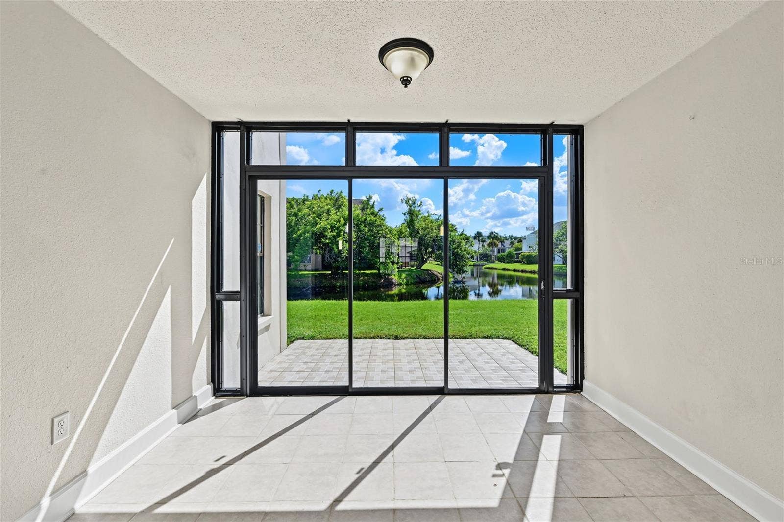 2460 HERON TERRACE, #102E, Clearwater, FL 33762 This area is rare and adds extra space that could be used as a sunroom, office, den, or studio. It sits just off the Living Room and looks over the water.