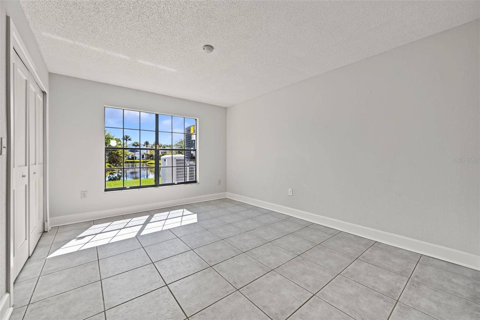2460 HERON TERRACE, #102E, Clearwater, FL 33762 Bedroom Two also has views of the water and the hall bathroom is located just outside.