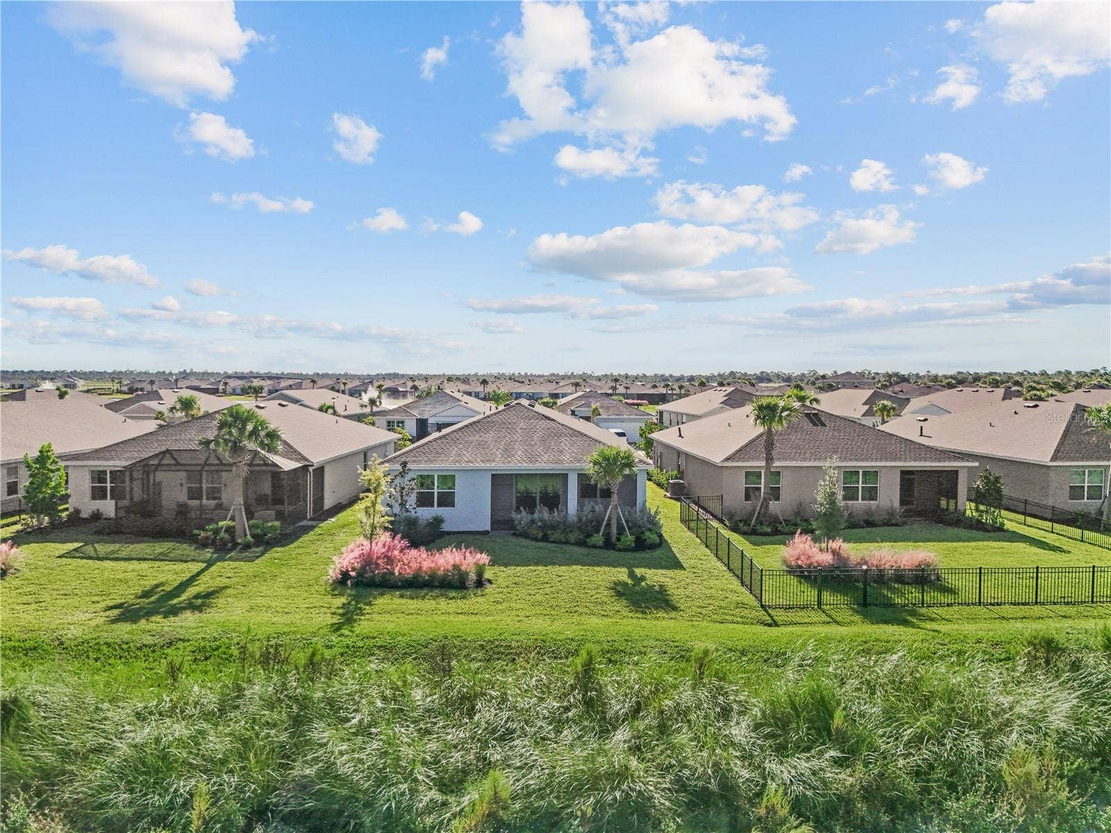 17740 SHADE TREE LOOP, Punta Gorda, FL 33982 Drone view of back of home.