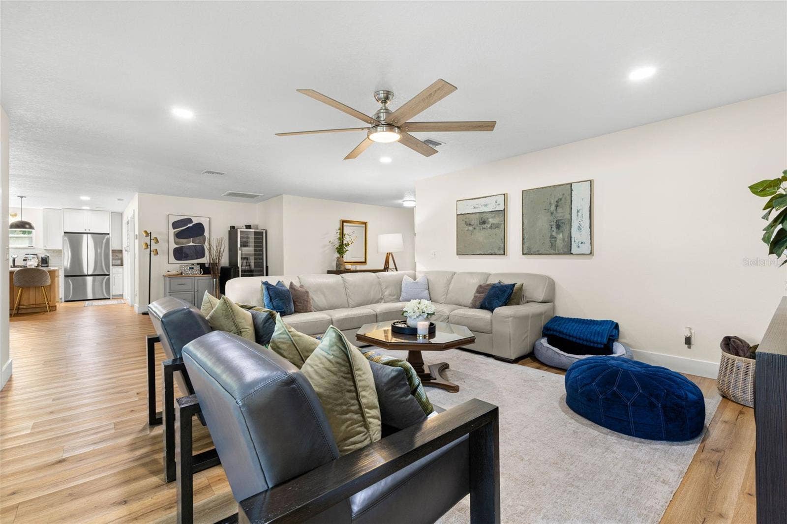 3013 GRAHAM LANE, Tampa, FL 33618 The open-concept floor plan creates an effortless flow between the generously proportioned living room and kitchen. Continuous wood-look luxury vinyl flooring, neutral finishes, and recessed lighting bring warmth and continuity to the main living areas.