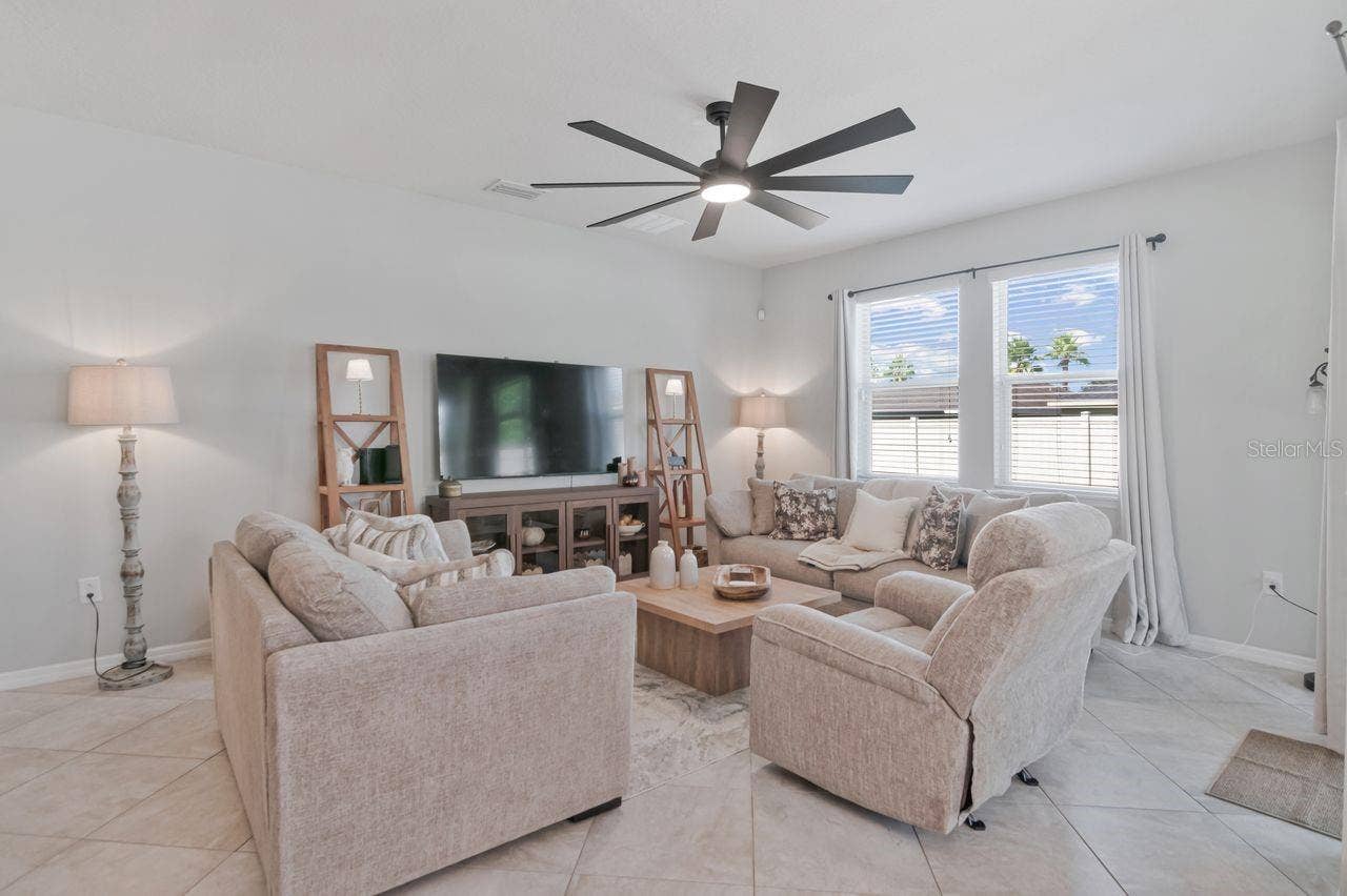 11143 SPRING POINT CIRCLE, Riverview, FL 33579 Expandable living area - lots of room yet still cozy. Large fan creates wonderful breeze.
