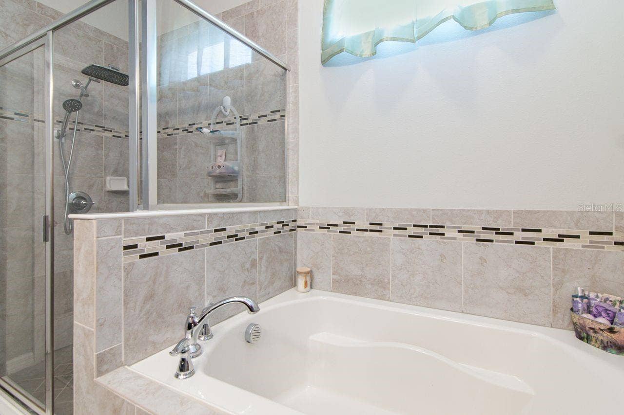 11143 SPRING POINT CIRCLE, Riverview, FL 33579 Separate soaking tub and walk in shower. Toilet has own room.