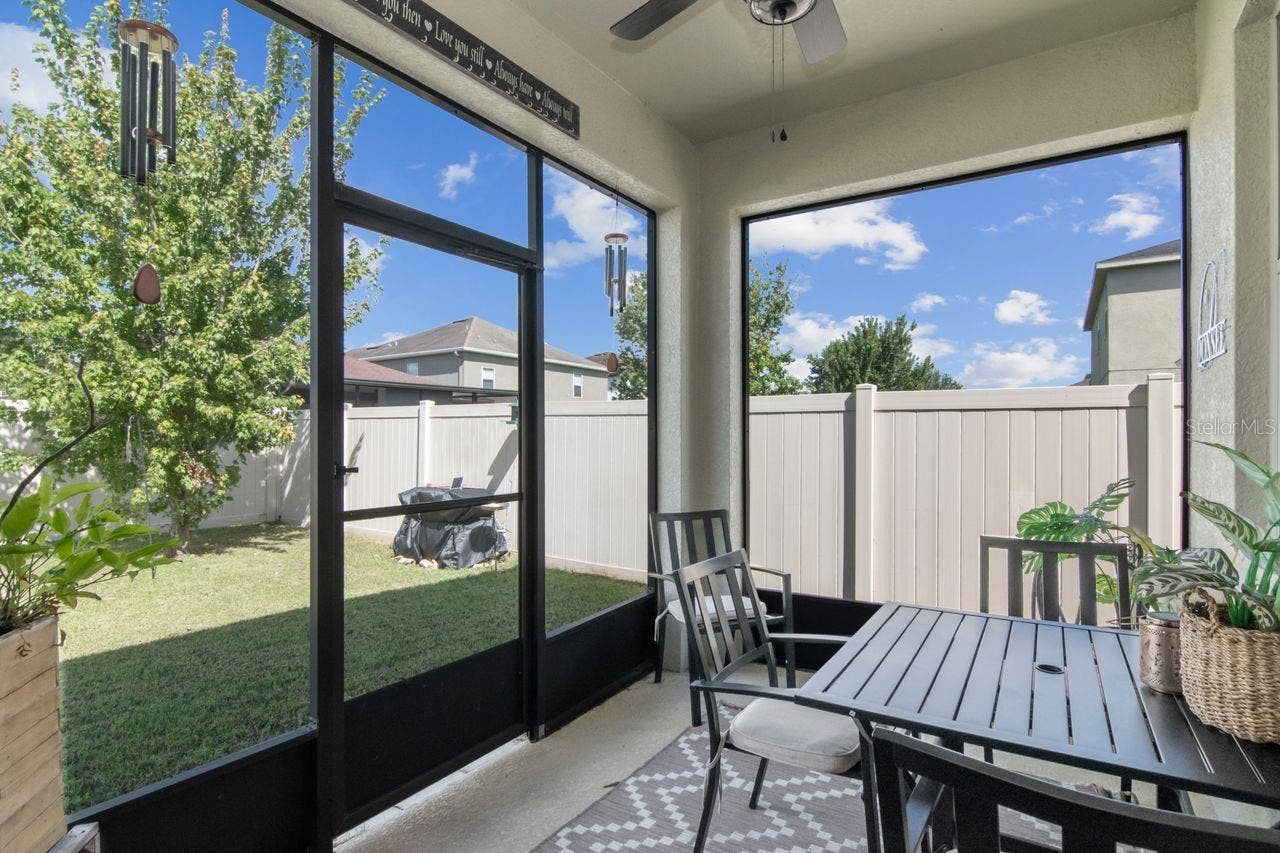 11143 SPRING POINT CIRCLE, Riverview, FL 33579 Enclosed patio with fan overhead.