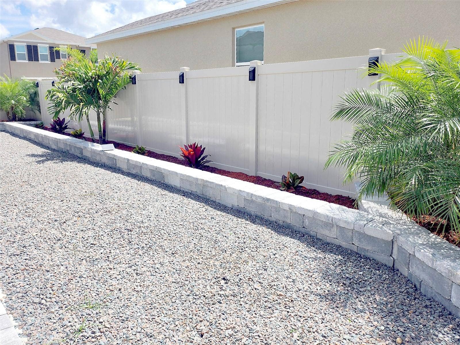 33310 MAJOR OAK DRIVE, Wesley Chapel, FL 33545 Backyard low-maintenance landscaped with decorative stone