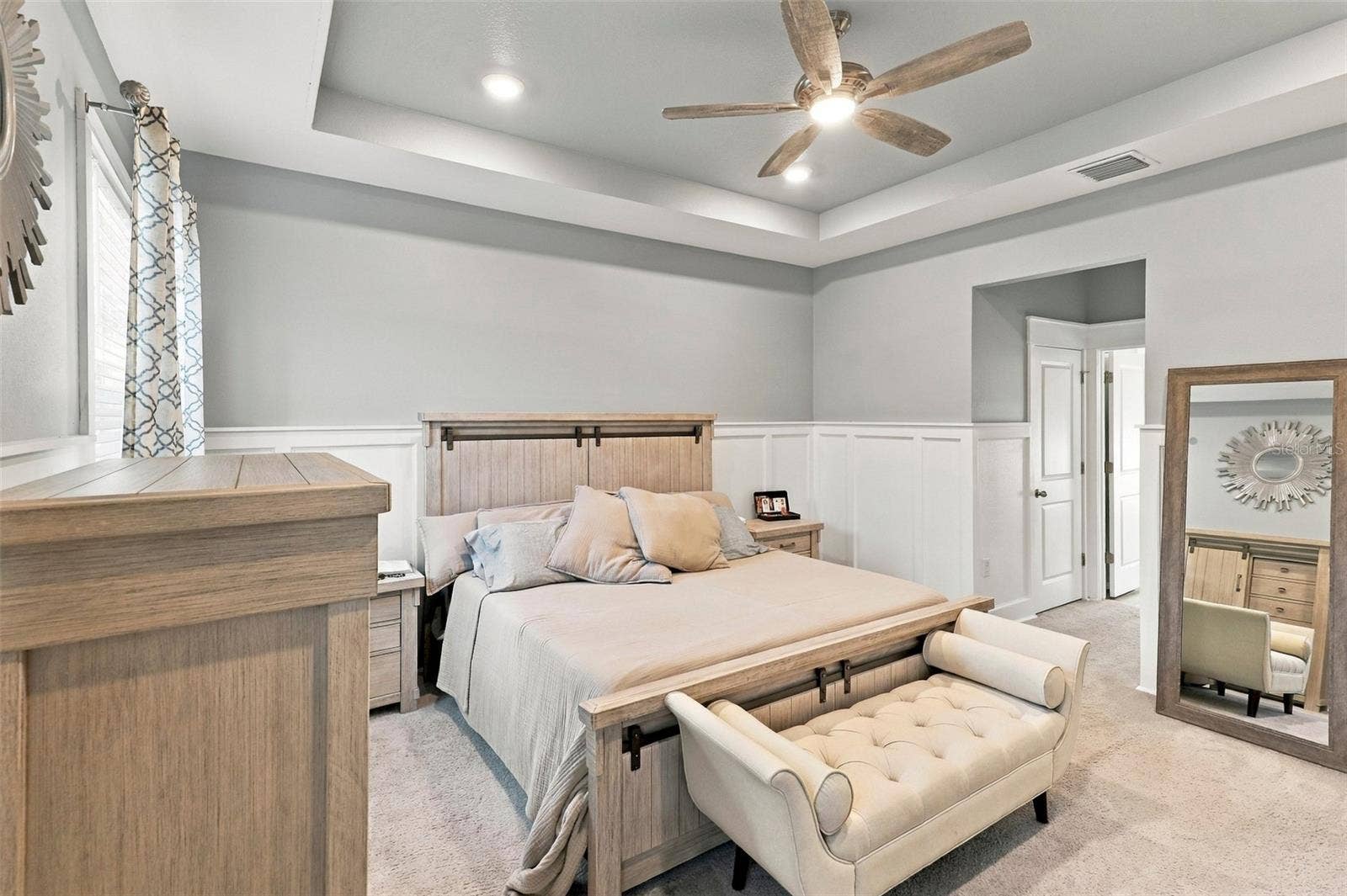 33310 MAJOR OAK DRIVE, Wesley Chapel, FL 33545 Primary Bedroom with Elegant Tray Ceiling and Ceiling Fan