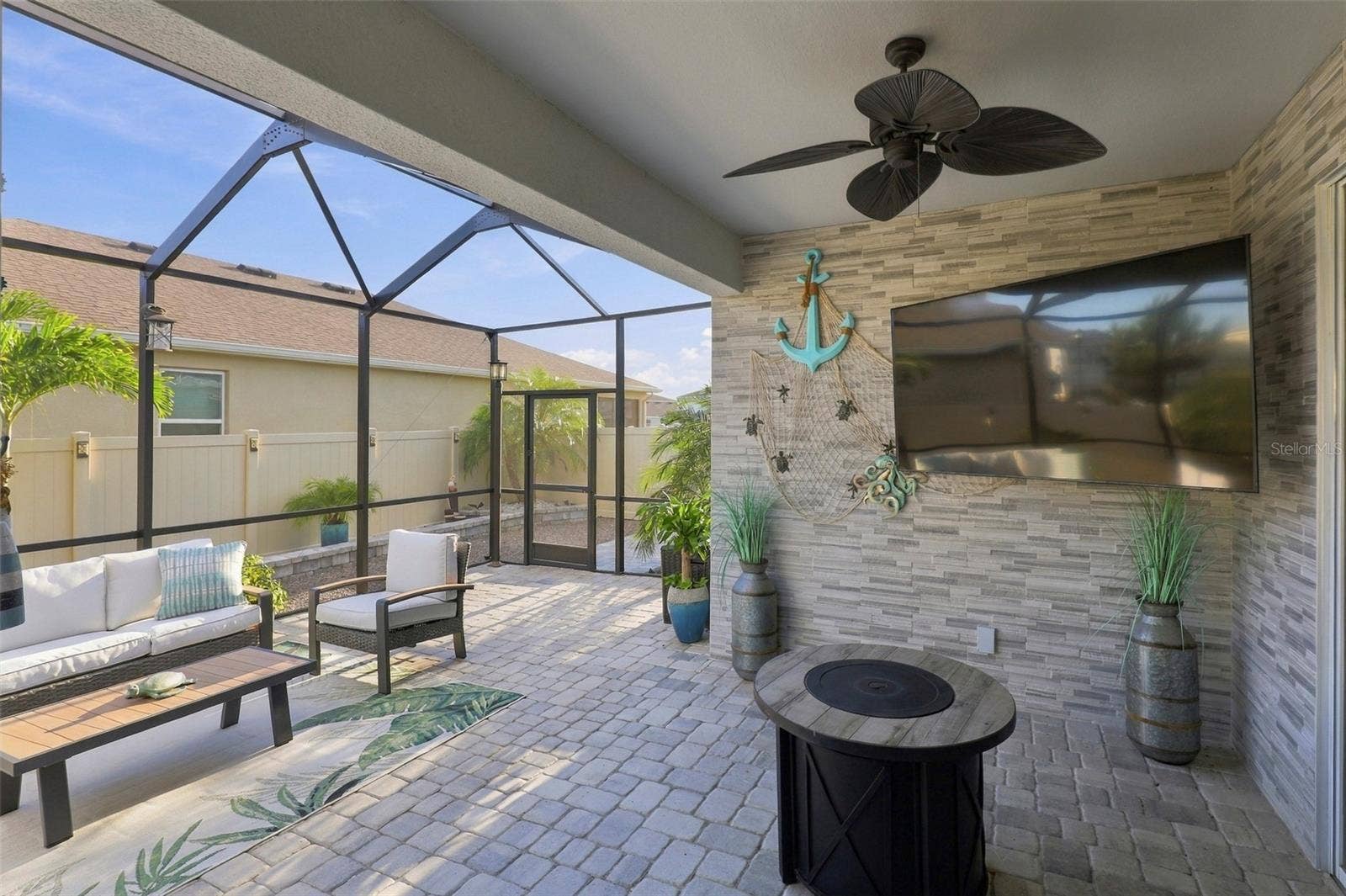 33310 MAJOR OAK DRIVE, Wesley Chapel, FL 33545 Covered Lanai with Ceiling Fan and Spacious Seating Area