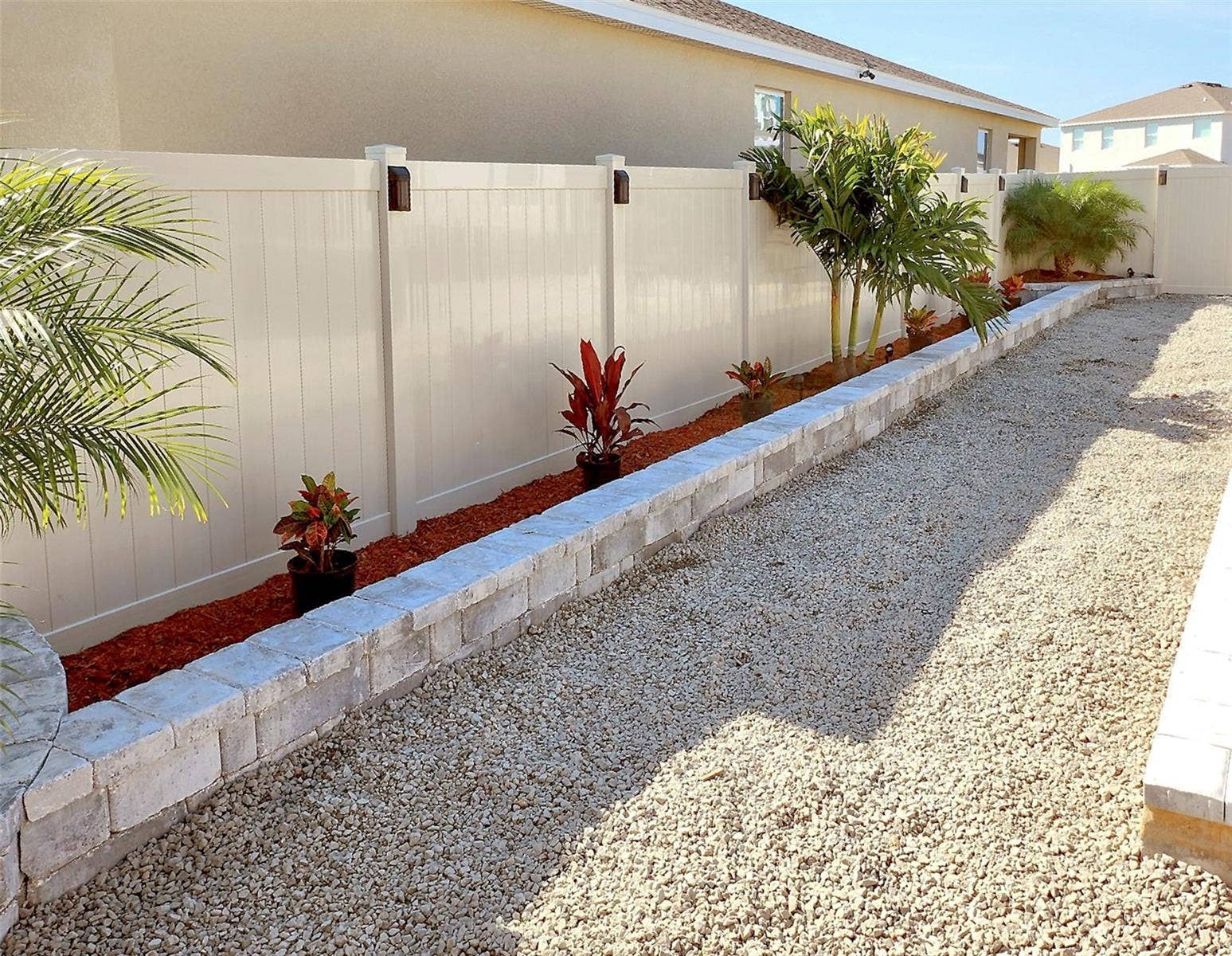 33310 MAJOR OAK DRIVE, Wesley Chapel, FL 33545 Backyard low-maintenance landscaped with decorative stone