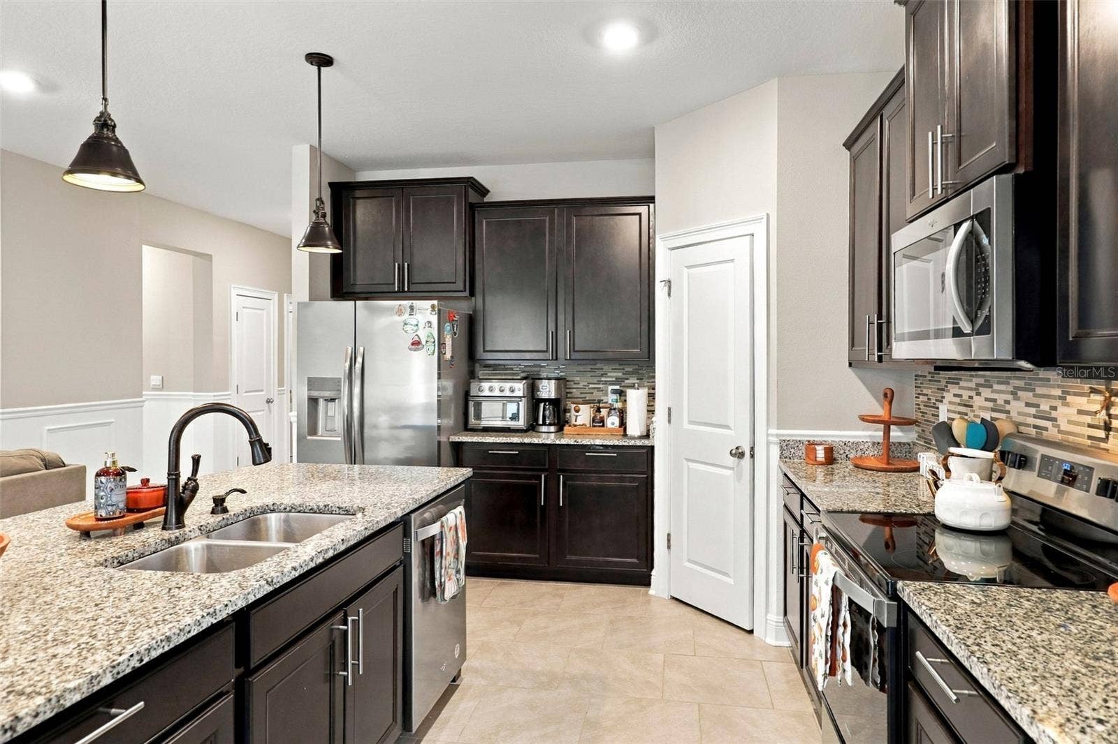 33310 MAJOR OAK DRIVE, Wesley Chapel, FL 33545 Spacious Kitchen with Ample Cabinetry and Counter Space