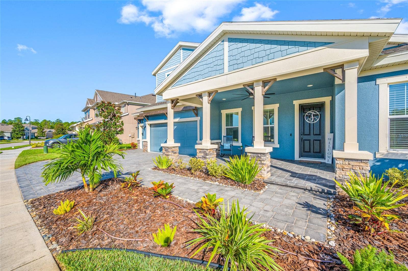 4161 GLADE WOOD LOOP, New Port Richey, FL 34655 Expansive porch with pavers