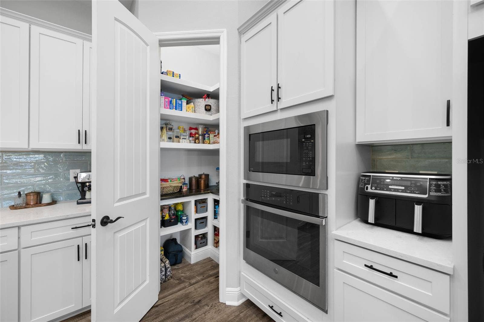 4161 GLADE WOOD LOOP, New Port Richey, FL 34655 GE Cafe and Profile Appliances and walk-in pantry