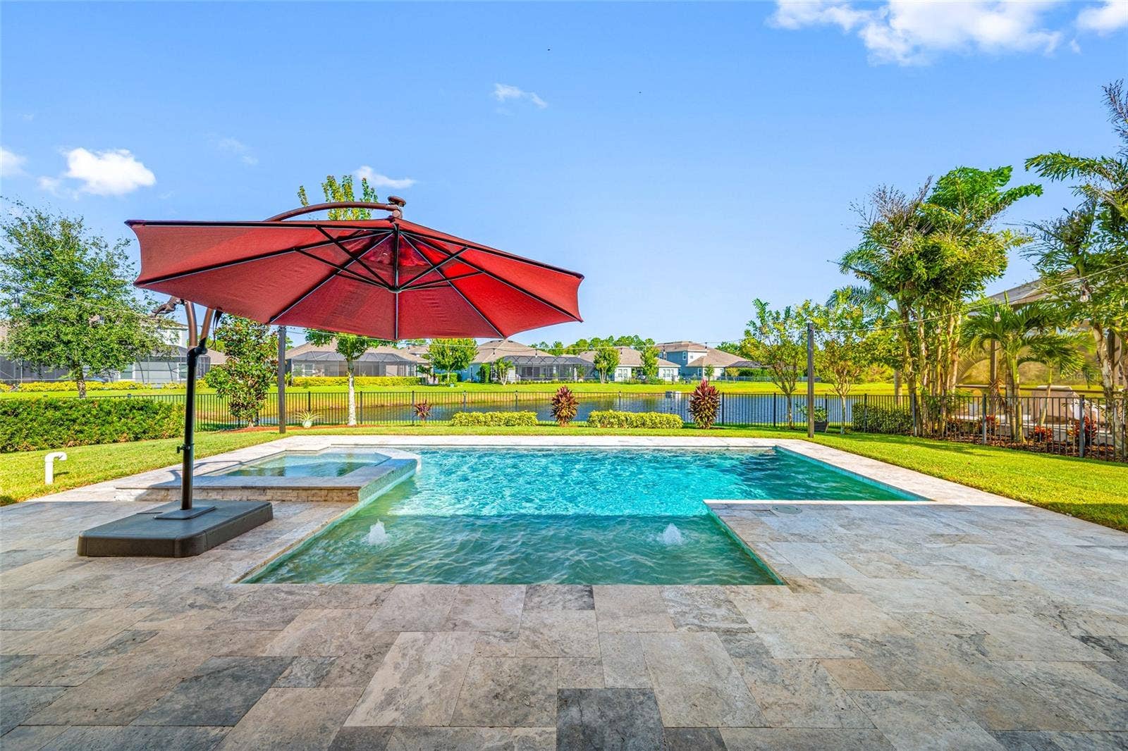 4161 GLADE WOOD LOOP, New Port Richey, FL 34655 Backyard Pool with Infinity edge Spa on pond