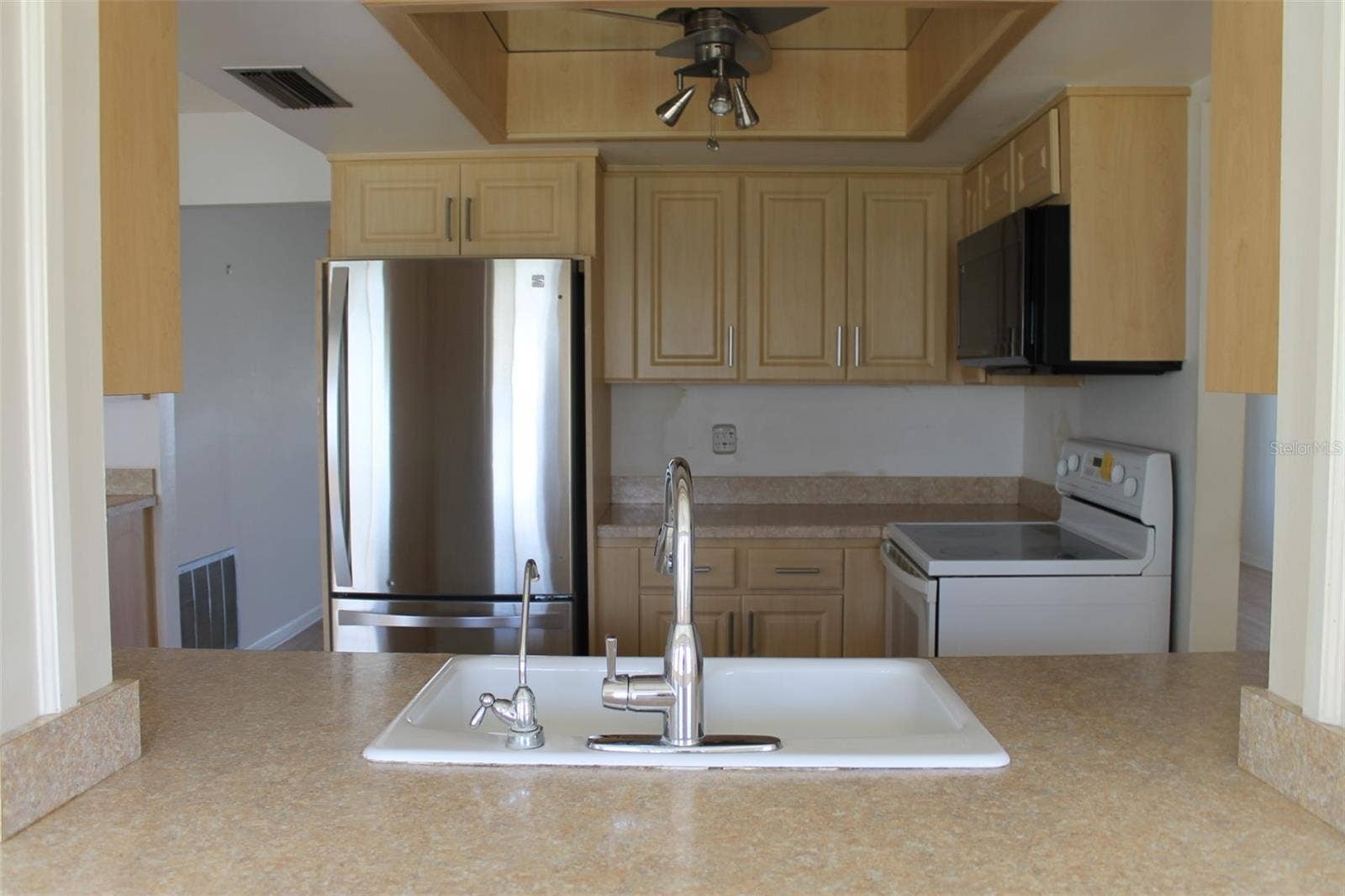 9510 45TH STREET N, Pinellas Park, FL 33782 Kitchen Pass Thru View from Florida Rm