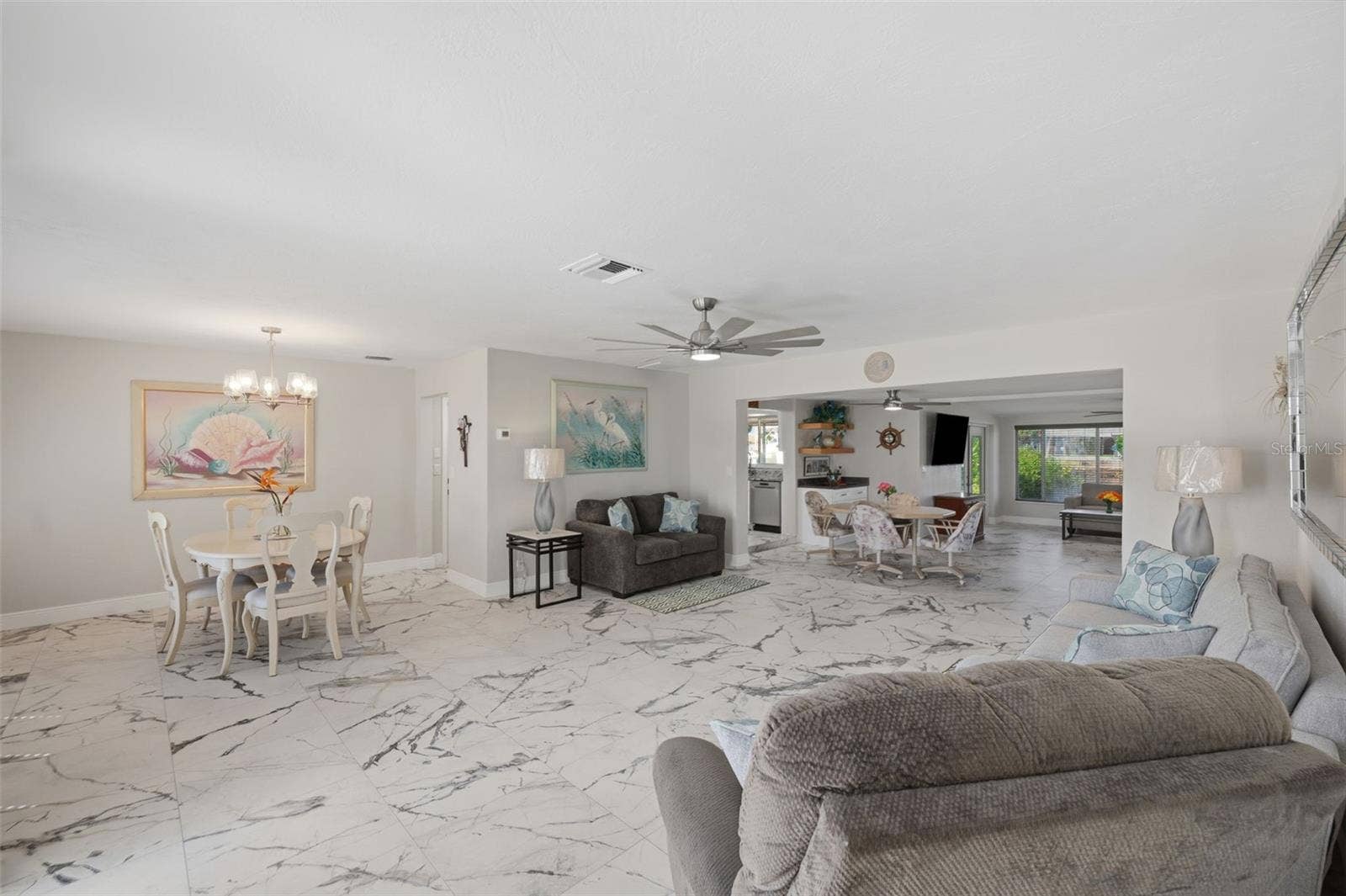 Updated lighting + fans. Spacious open floor plan.