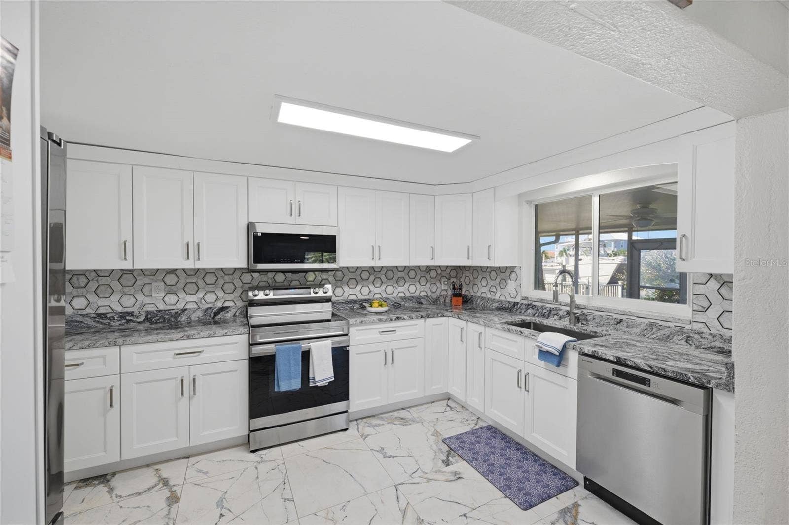 Abundant Kitchen cabinets. All new!  Water view.