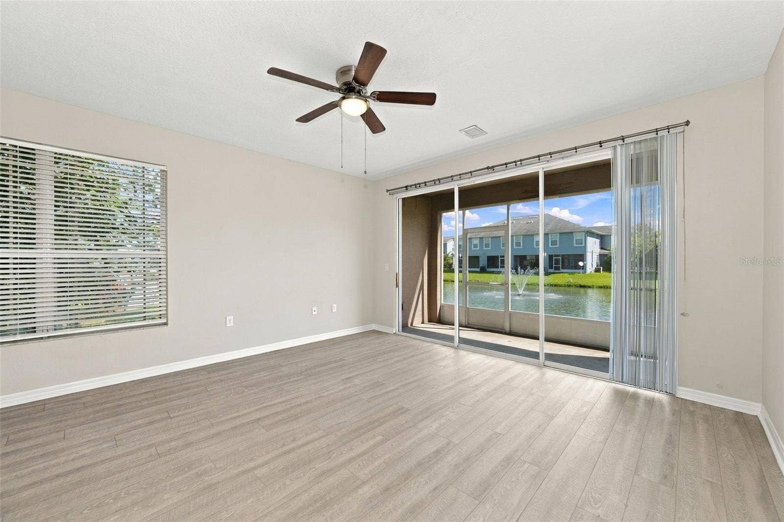 10313 WILLOW LEAF TRAIL, Tampa, FL 33625 Living Room to Screened-In Patio