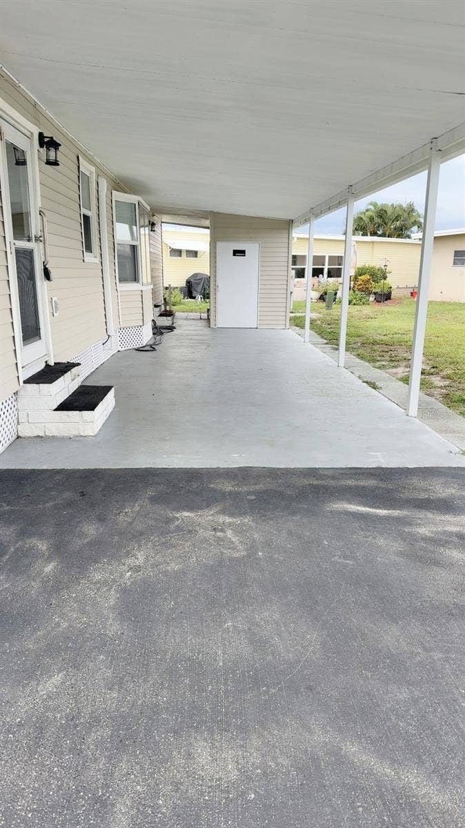 7173 MOUNT BRISTOL BOULEVARD NE, #458, St Petersburg, FL 33702 Long carport holds 2 vehicles easily