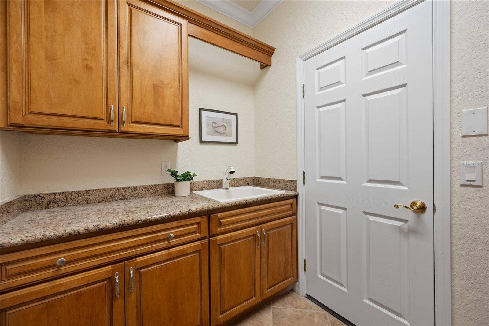 Laundry inc. Wet Sink, Cabinetry & Folding Area!