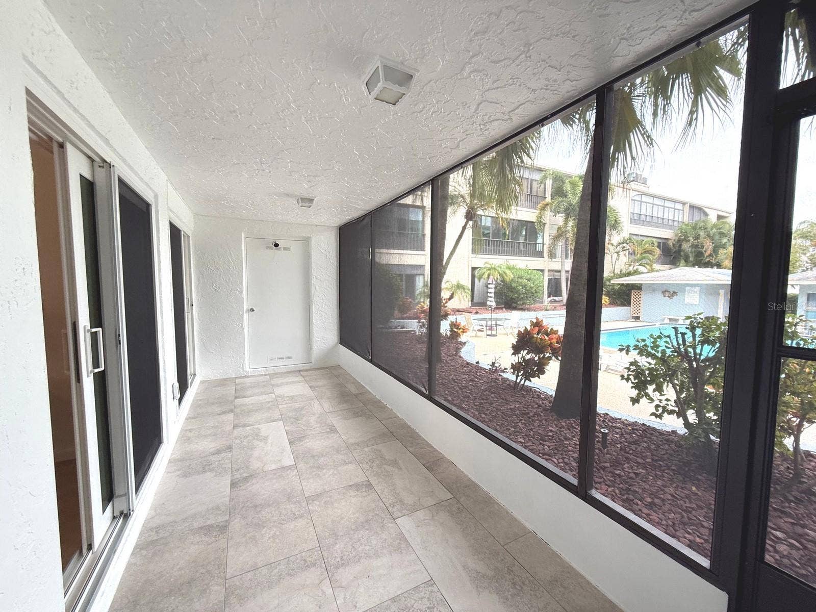 215 VALENCIA BOULEVARD, #107, Belleair Bluffs, FL 33770 POOL and GARDEN VIEW