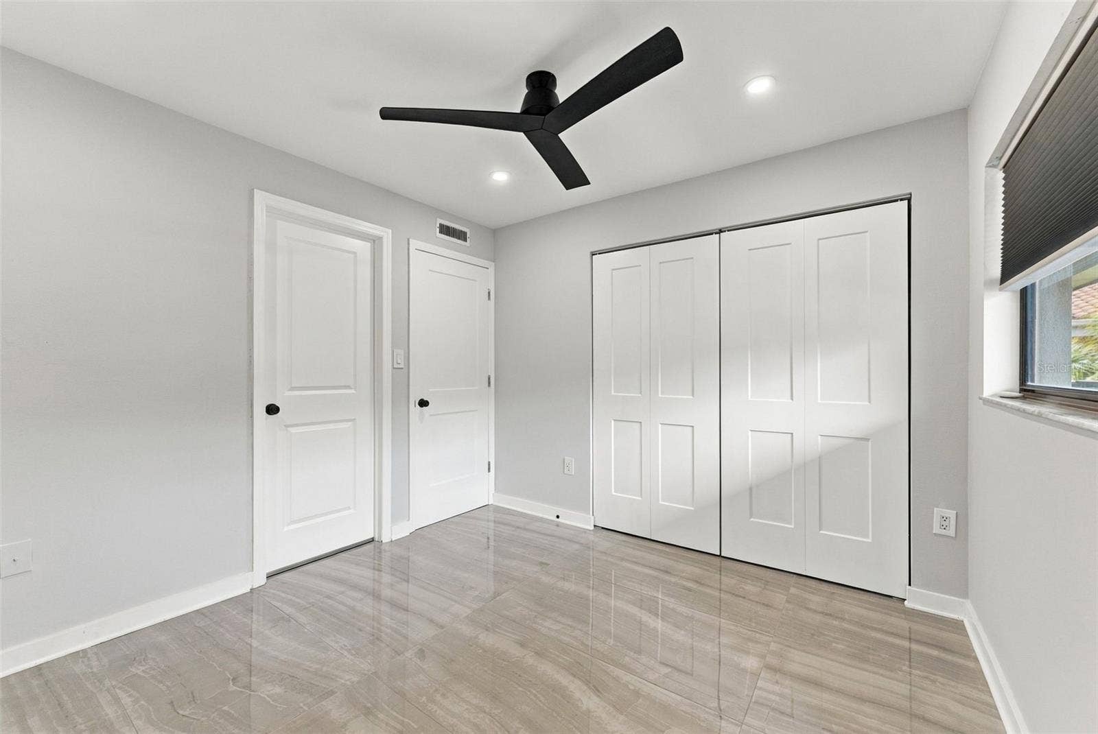 Generously sized bedroom two with a convenient built-in closet