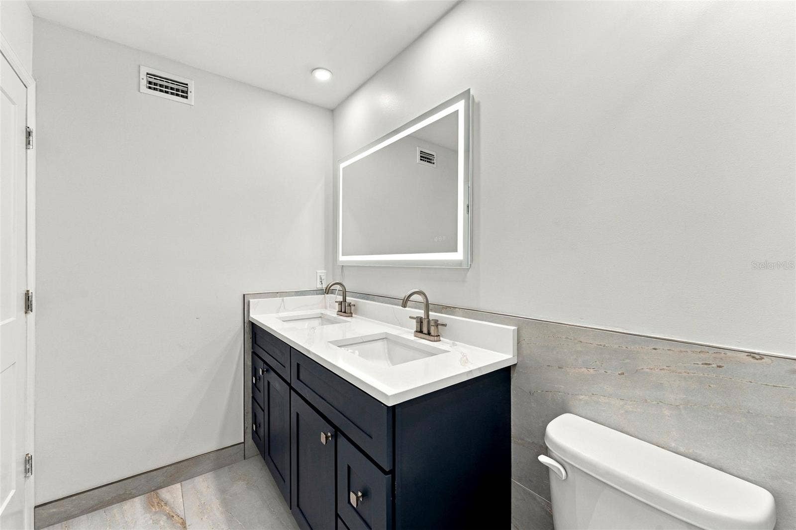 Completely remodeled primary bathroom with a beautiful double vanity