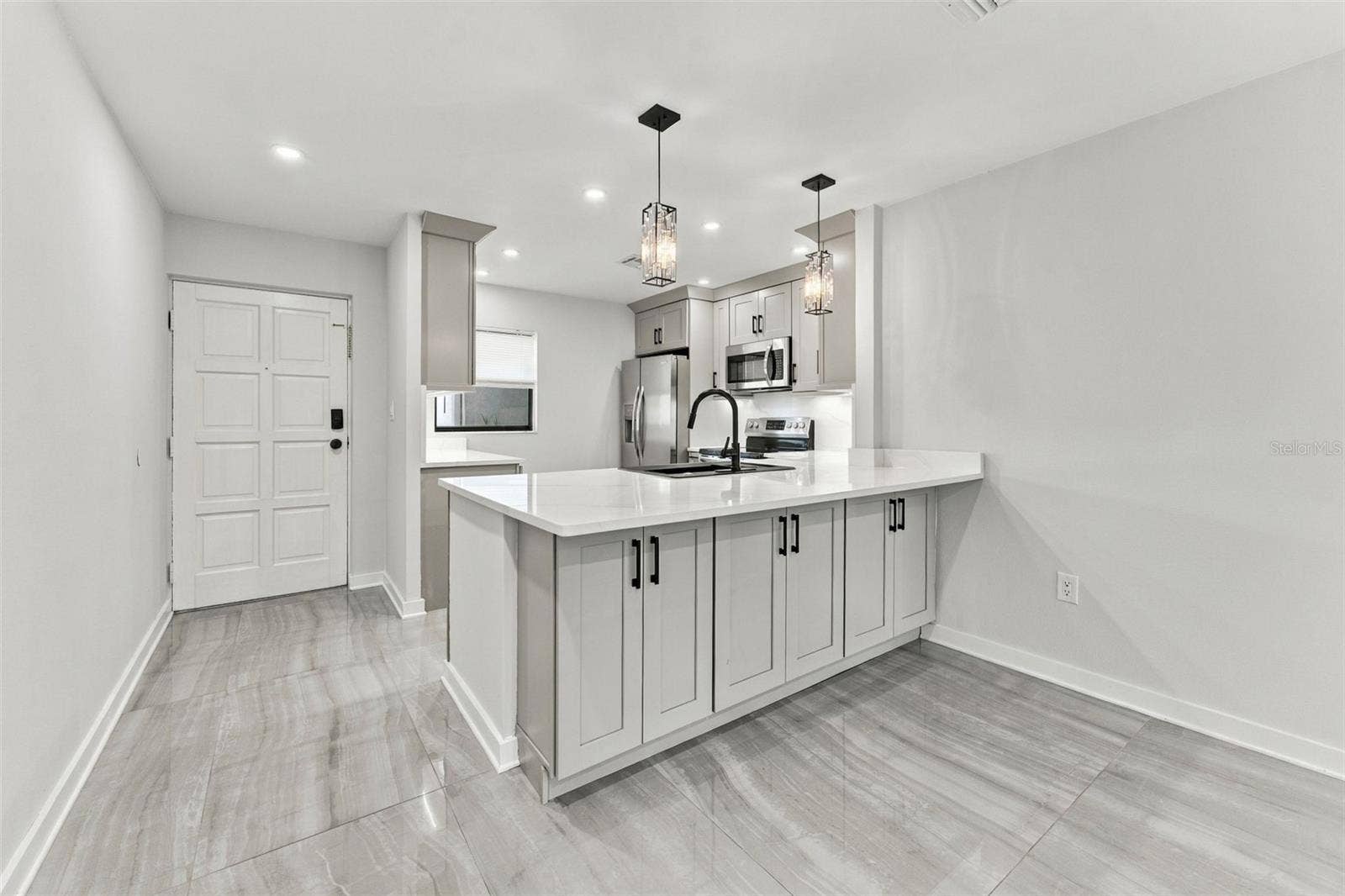 Front entry with the beautifully remodeled kitchen