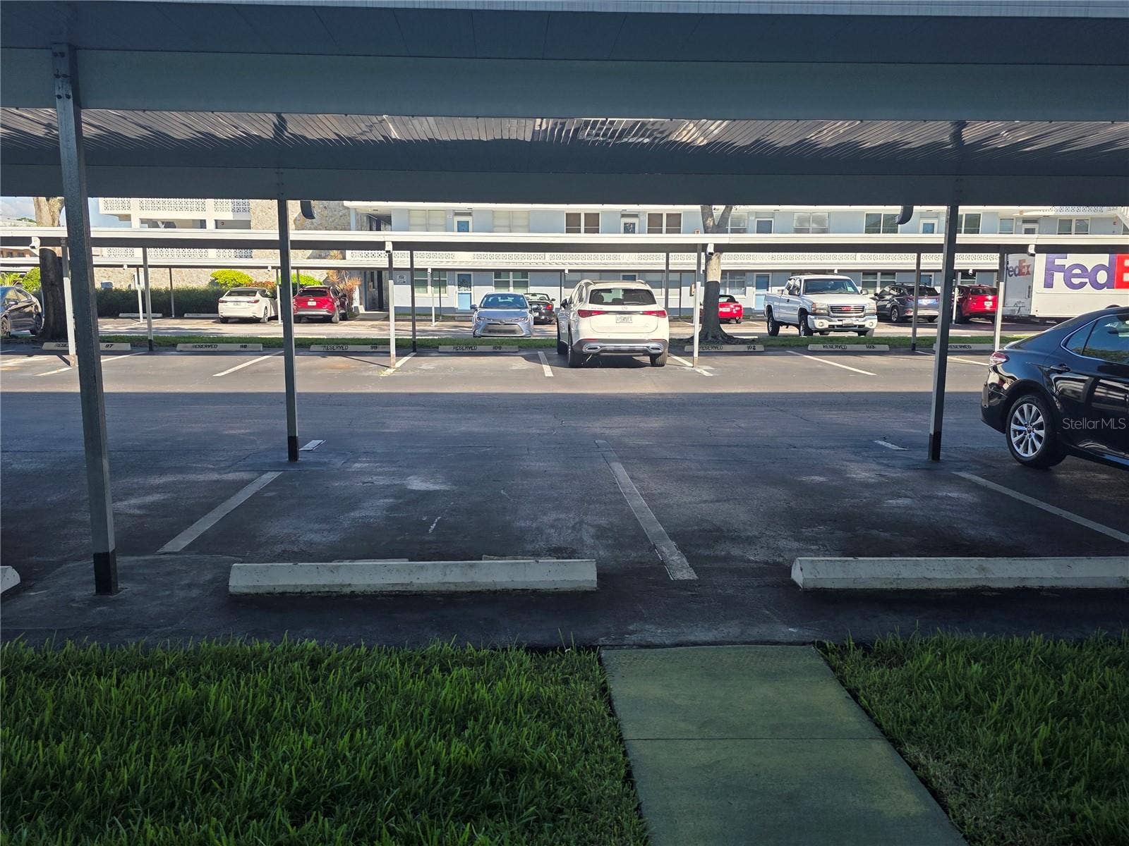 carport is directly in front of condo, just a few steps