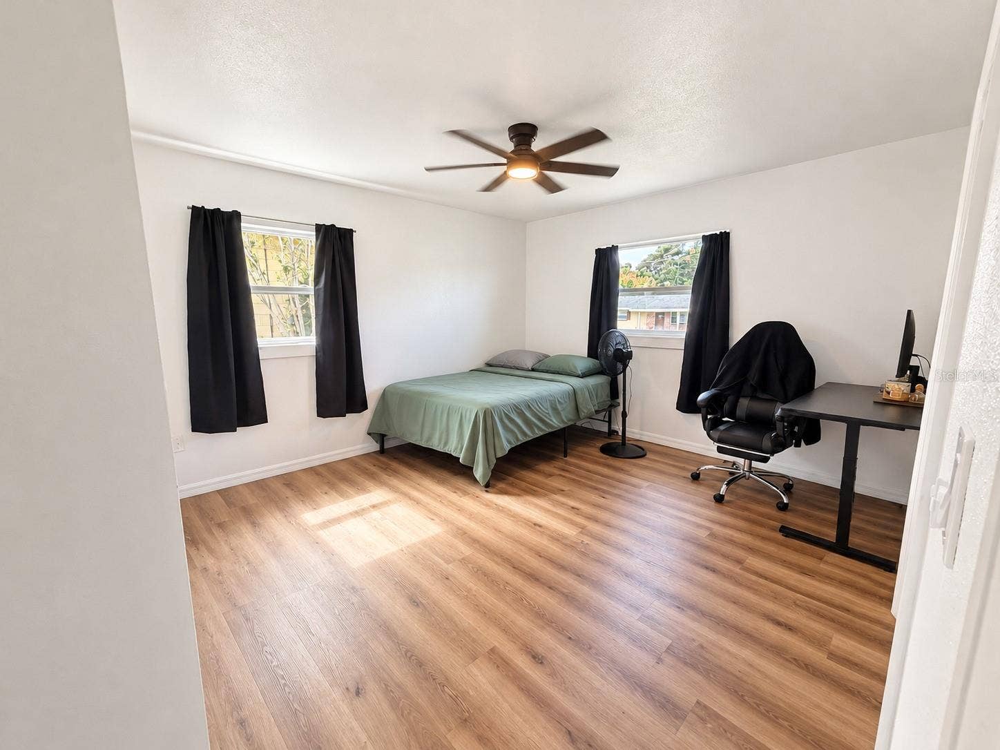 120 HAWTHORNE ROAD, Winter Haven, FL 33884 Flexible bedroom space with wood-look flooring, neutral finishes, and natural light with built in closet