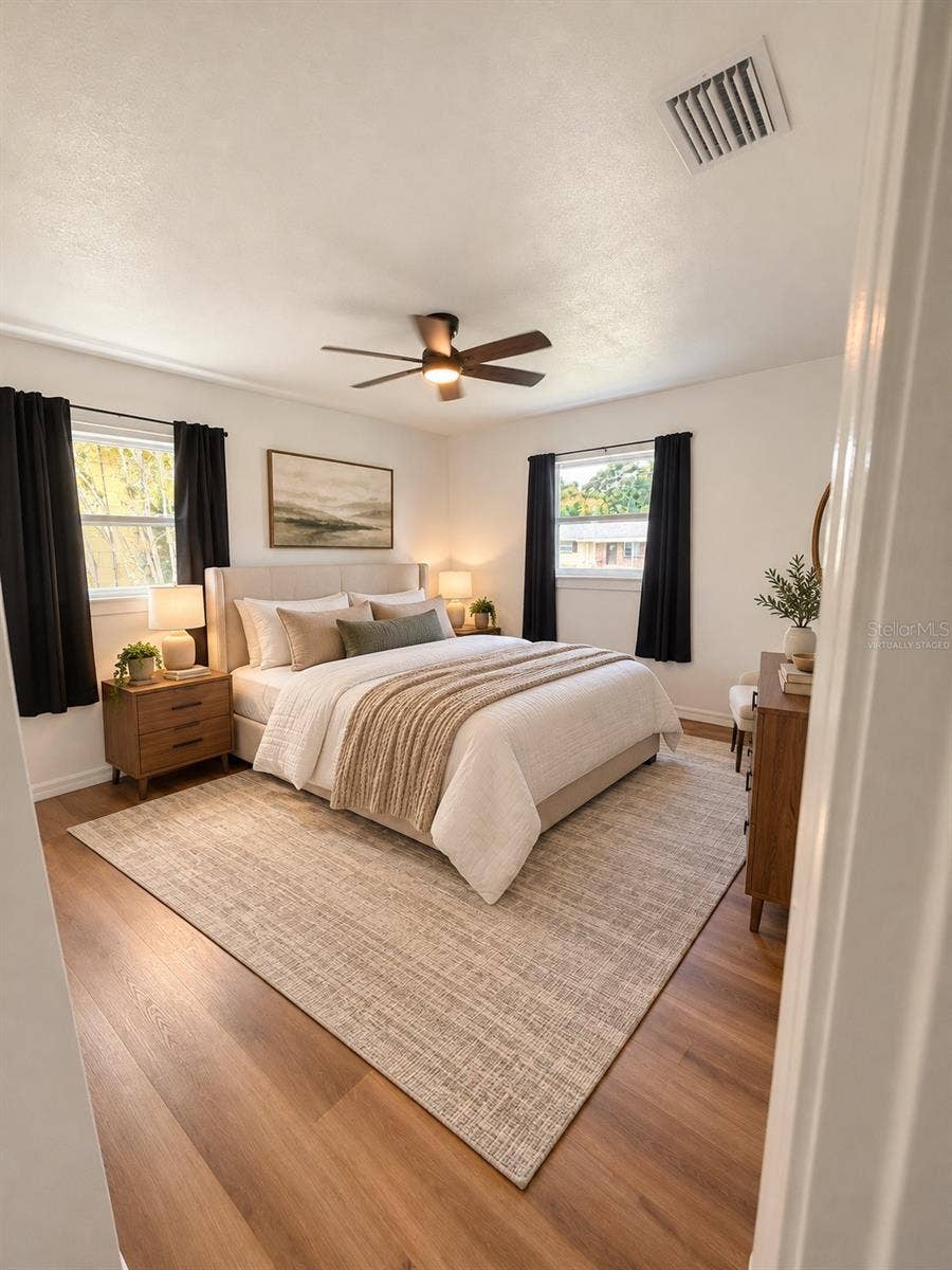 120 HAWTHORNE ROAD, Winter Haven, FL 33884 Virtually staged bedroom showcasing its potential as a comfortable guest room.