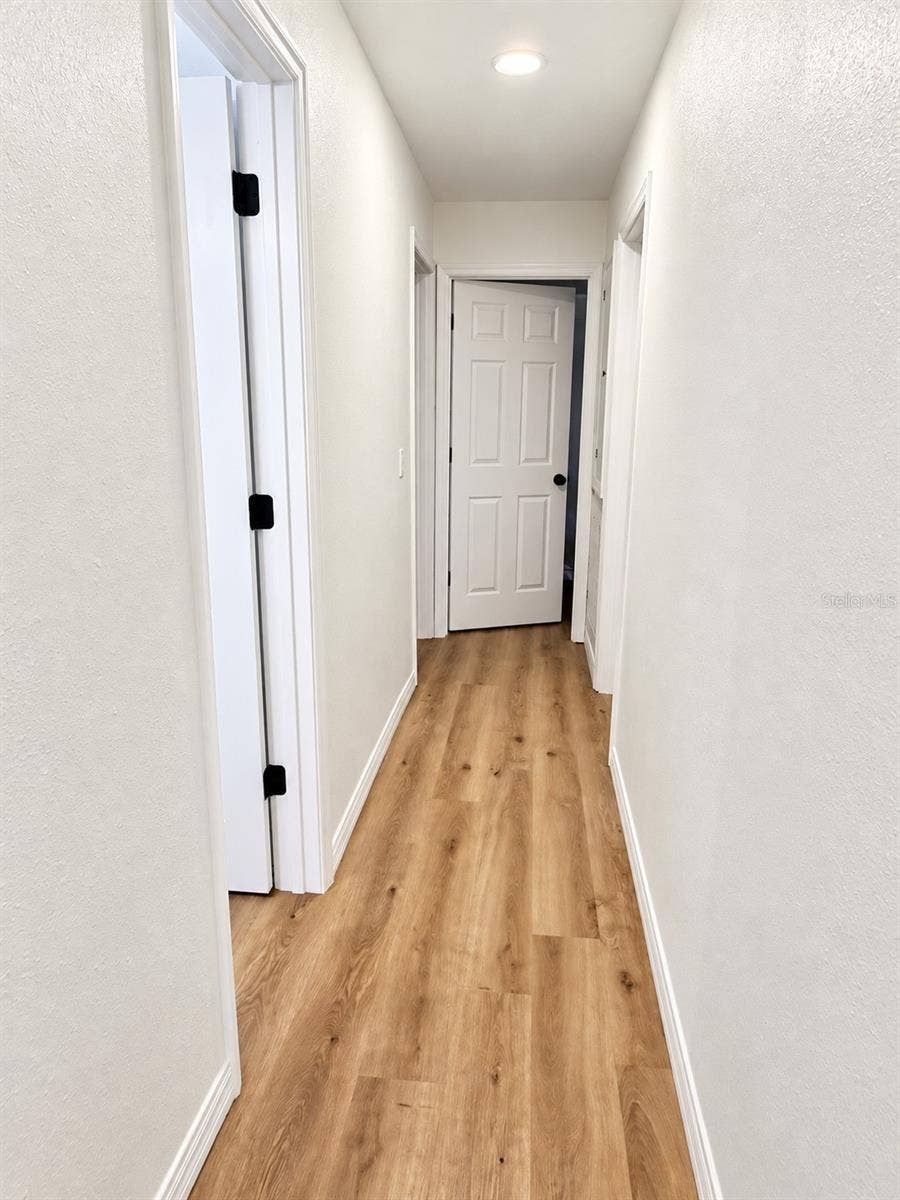 120 HAWTHORNE ROAD, Winter Haven, FL 33884 Hallways to the bathrooms and bedrooms