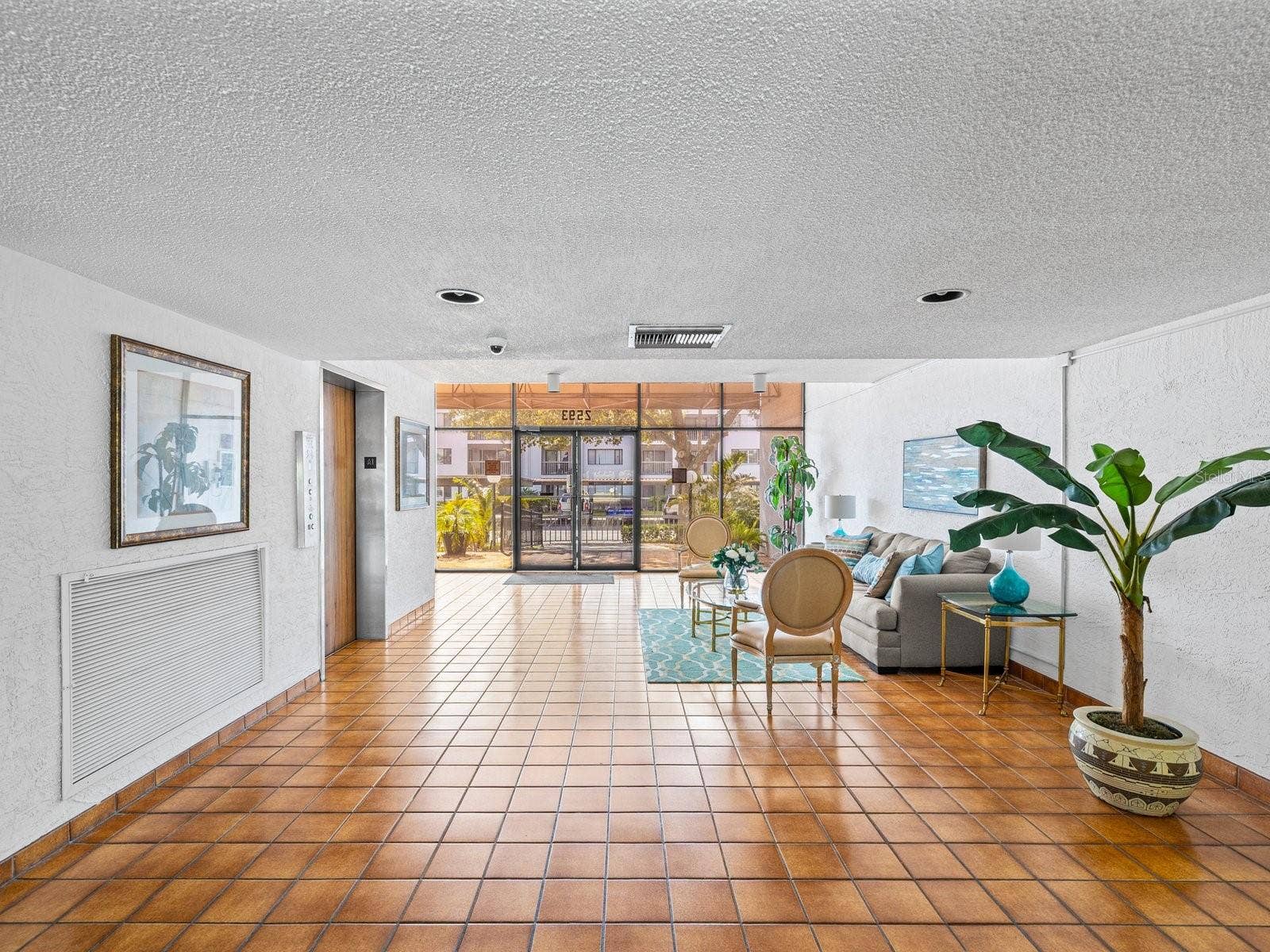 Building entry on main floor is security keyed entry with inviting sitting area and elevator on the left