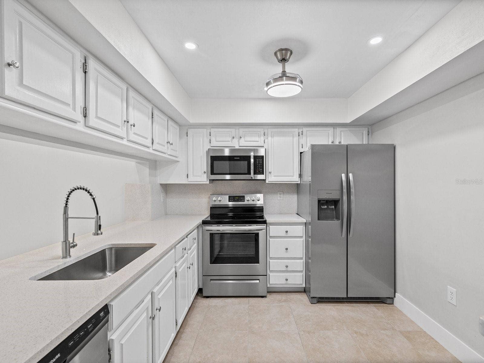 Quartz counters large sink stainless appliances