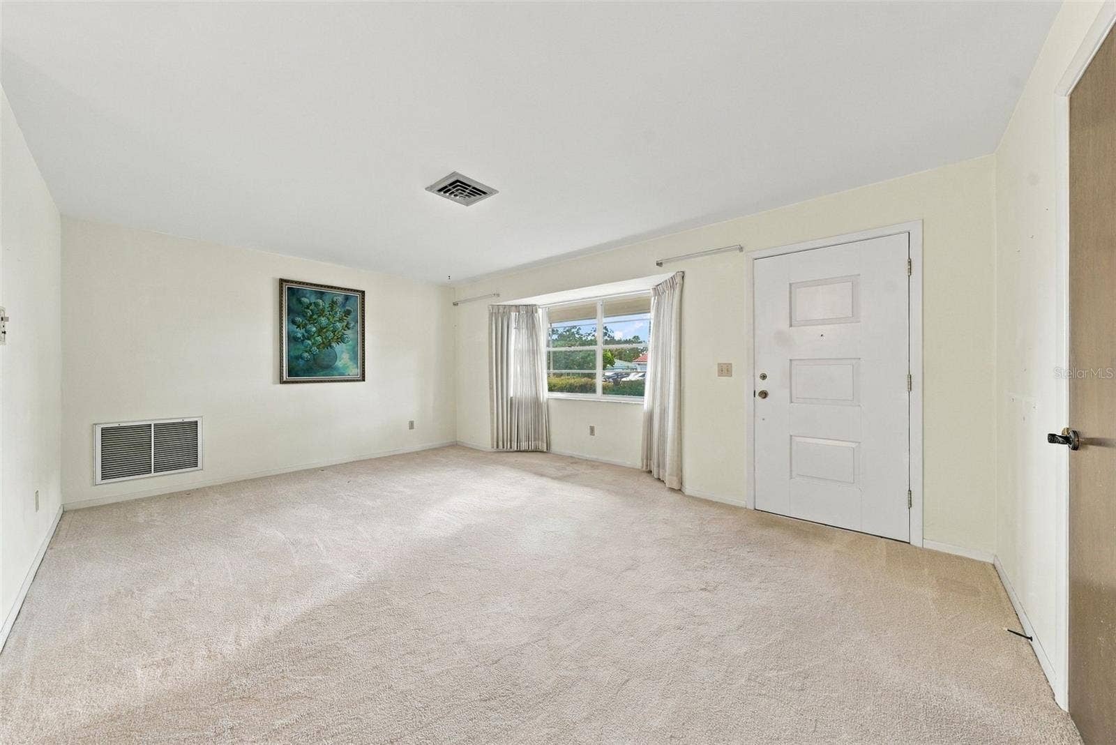 12266 69TH TERRACE, Seminole, FL 33772 Alternate view of living area featuring large windows