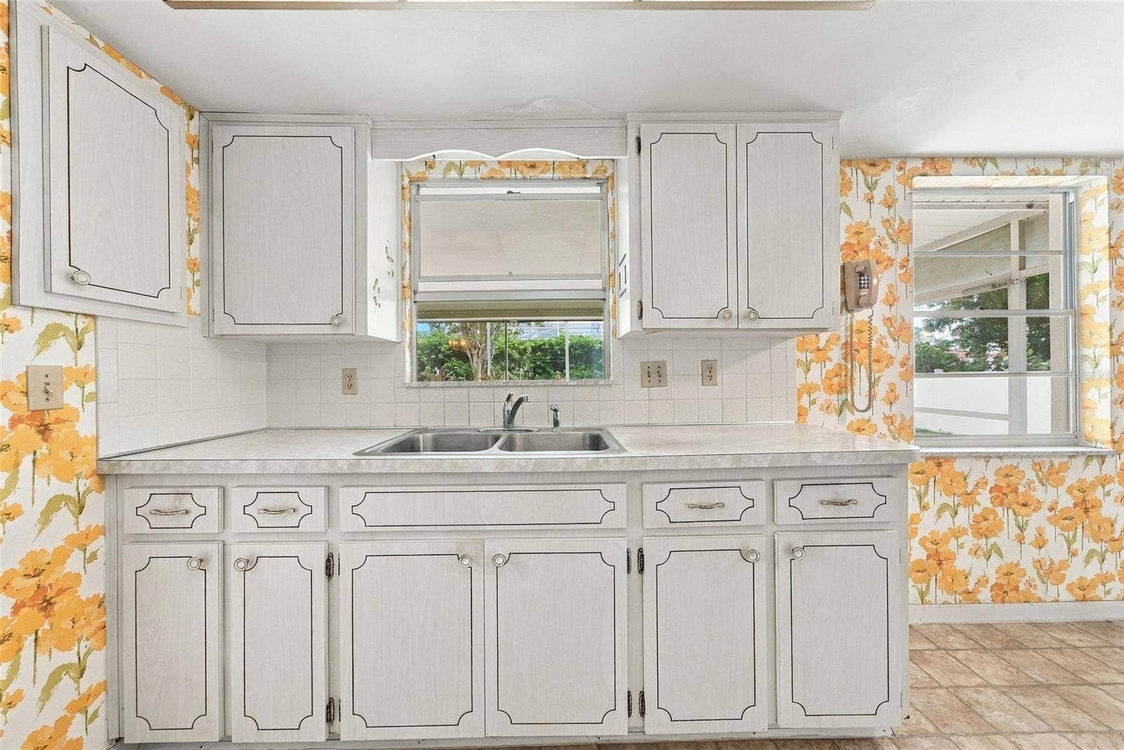 12266 69TH TERRACE, Seminole, FL 33772 Kitchen view showcasing ample cabinetry and counter space