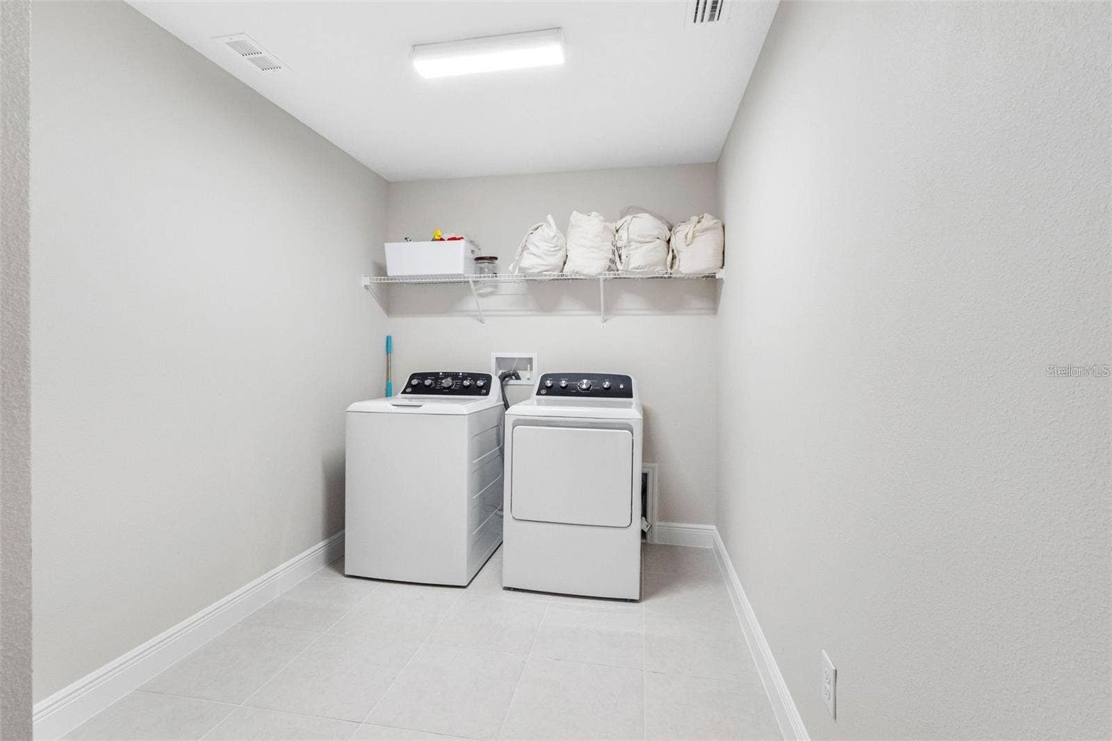 14868 SUMMER BRANCH DRIVE, Lithia, FL 33547 Upstairs laundry room with tile floors