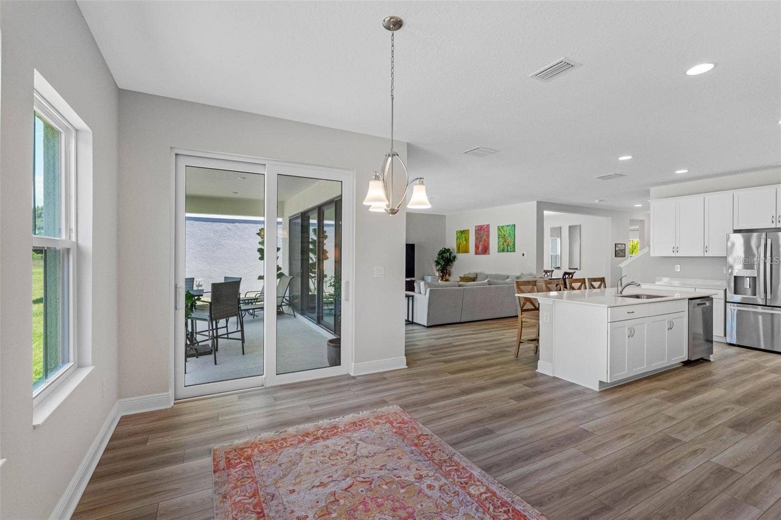 14868 SUMMER BRANCH DRIVE, Lithia, FL 33547 Sunlit cafe with sliding glass doors to the lanai