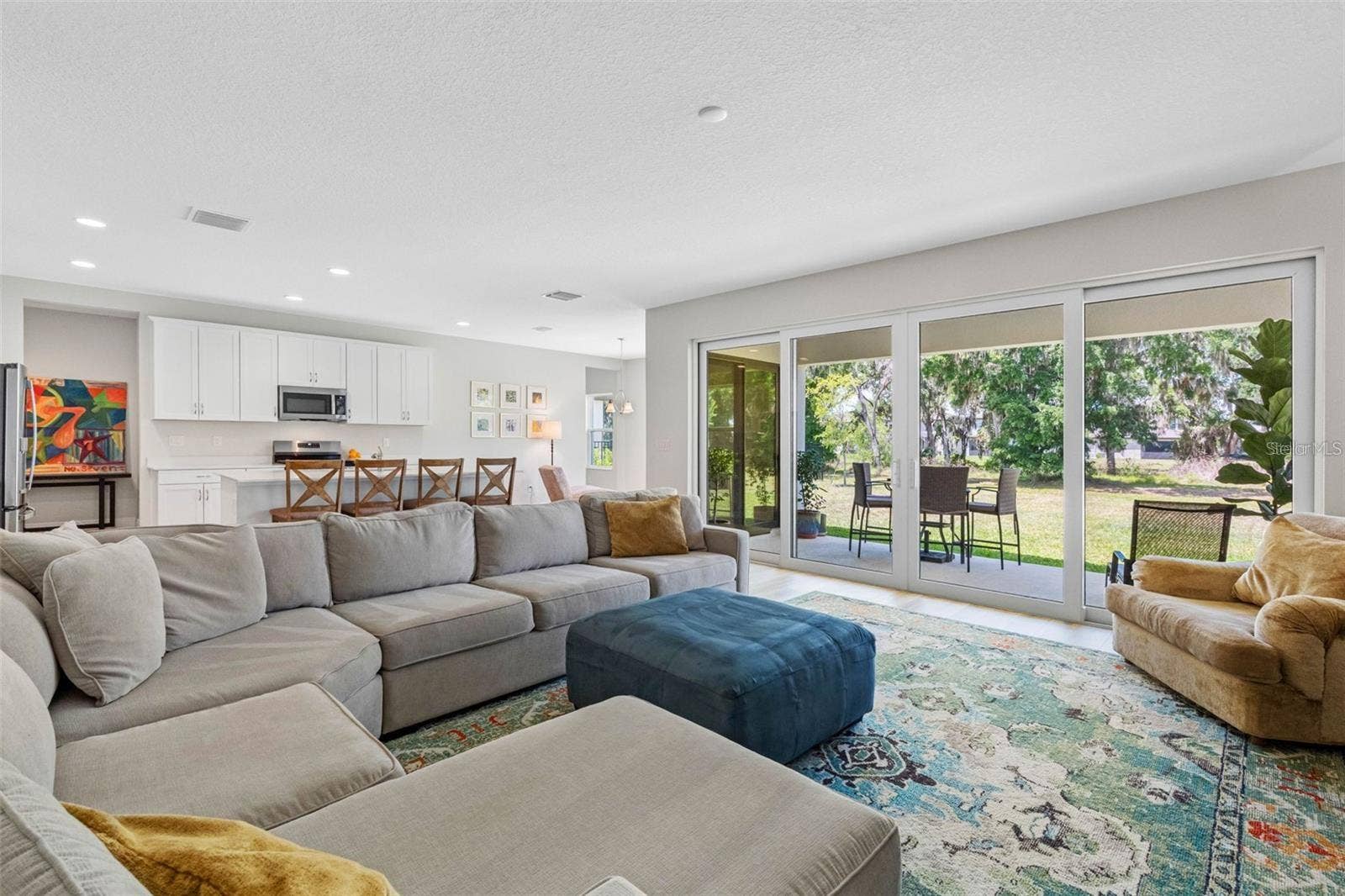 14868 SUMMER BRANCH DRIVE, Lithia, FL 33547 Open great room with a 16-foot sliding glass door to the covered lanai