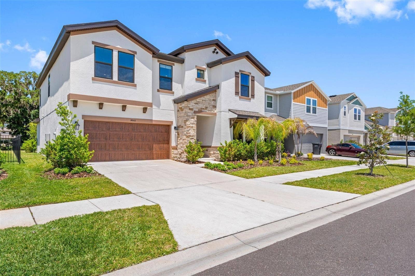 14868 SUMMER BRANCH DRIVE, Lithia, FL 33547 Landscaped front yard with sidewalks in Hinton at Hawkstone