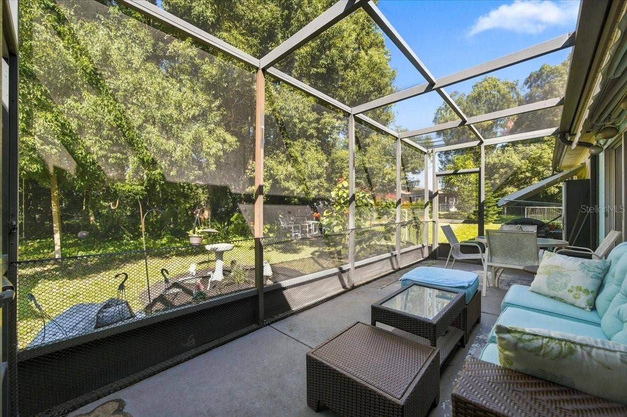 8109 RUMFORD COURT, Hudson, FL 34667 Screen in Patio with an Retractable Awning
