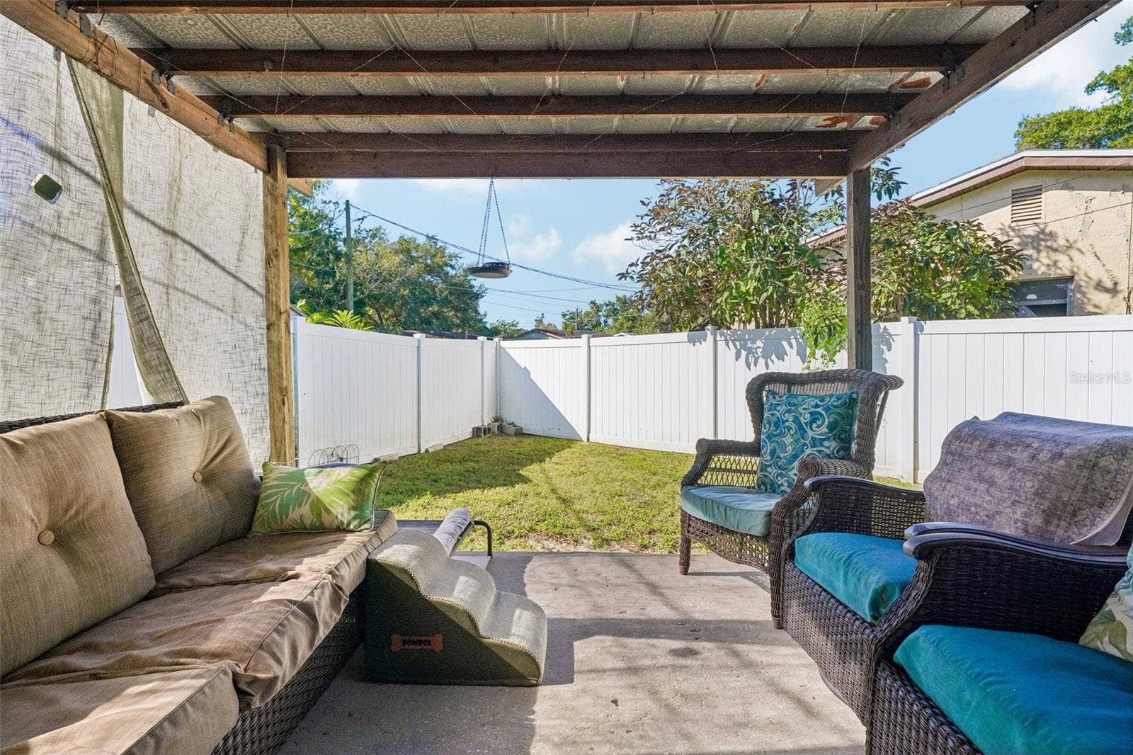 4100 45TH AVENUE N, St Petersburg, FL 33714 Unit 1 covered outdoor area- white vinyl fence for privacy