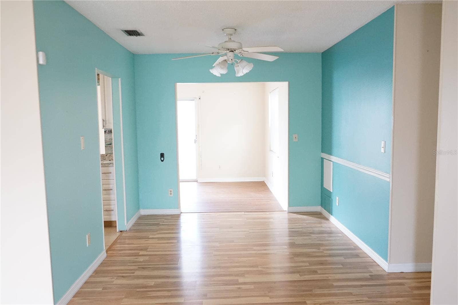 703 HUXLEY PLACE, Sun City Center, FL 33573 dining room to family roomnd doorway to