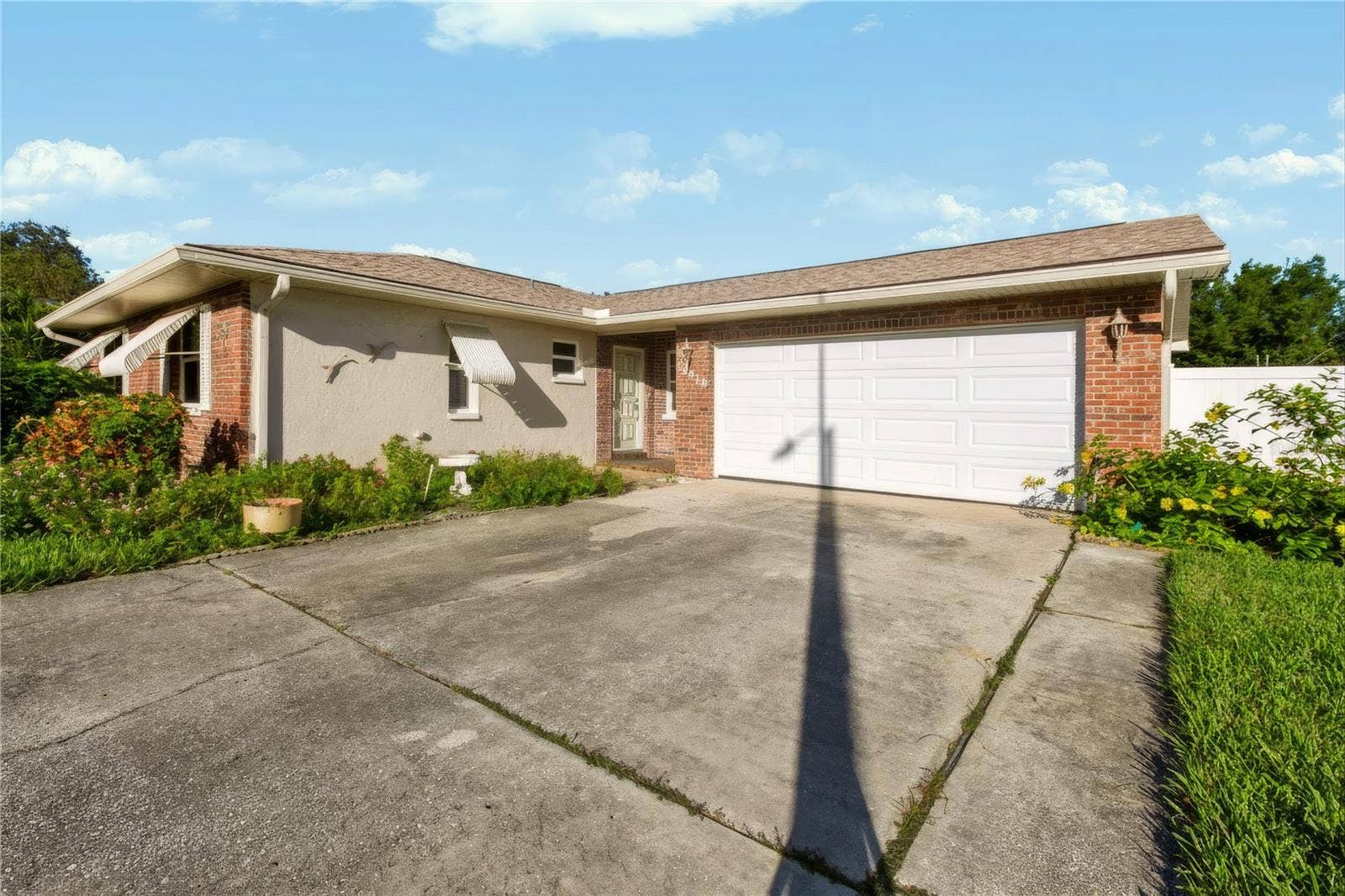 12939 115TH STREET, Largo, FL 33778 Front of the home with large driveway