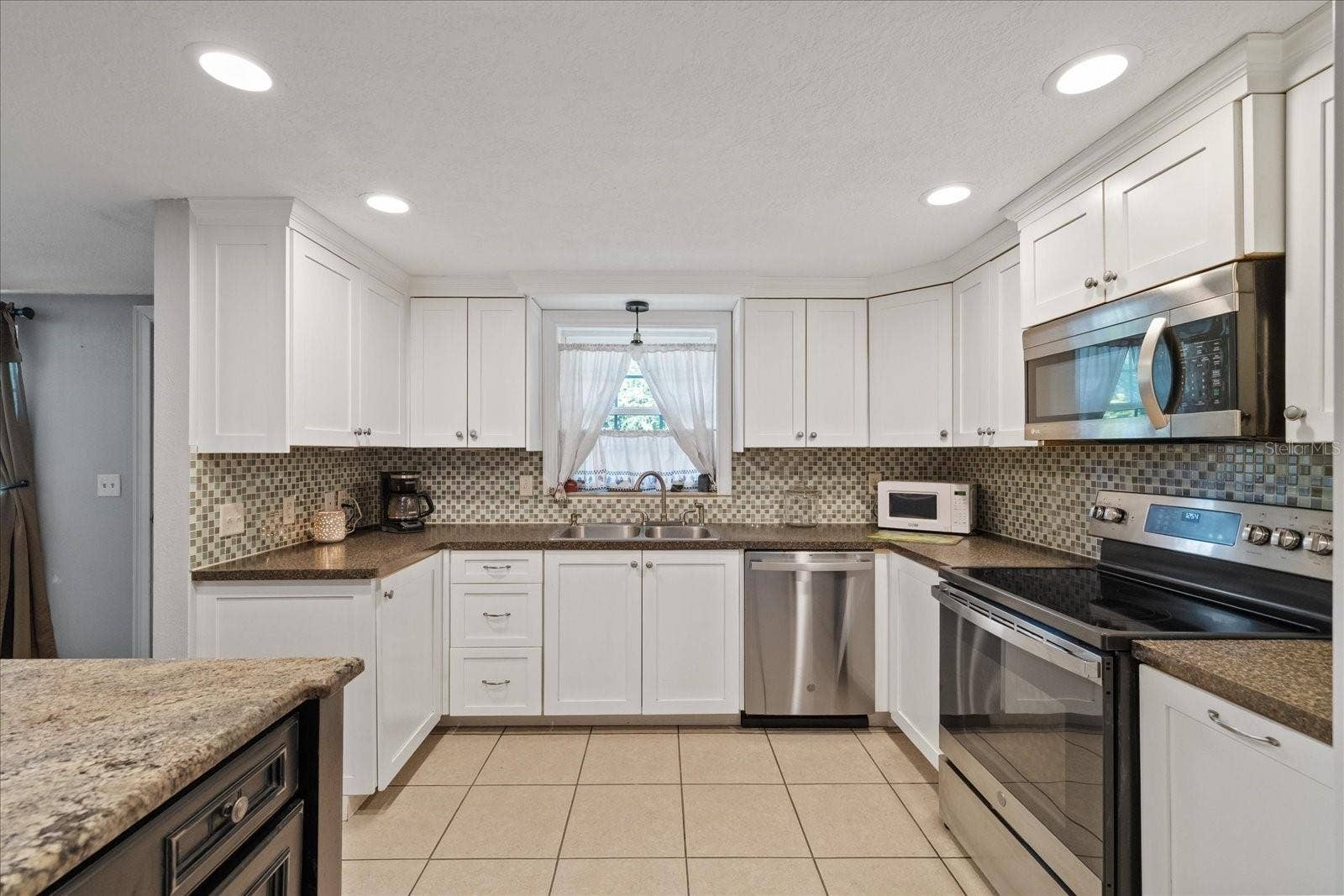 Large open Kitchen with window over the sink
