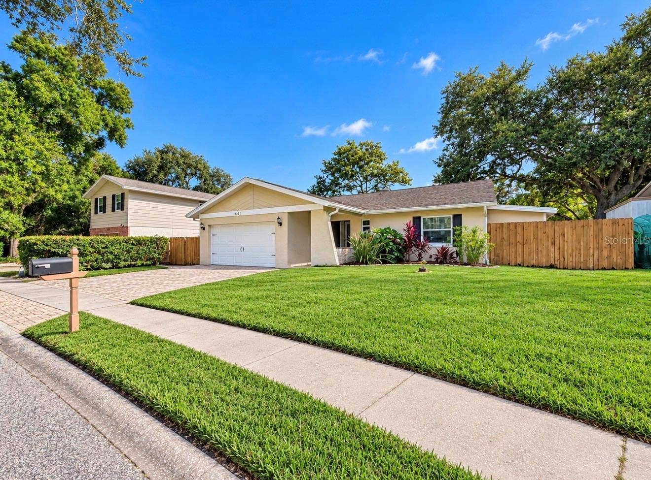 1231 ROSEWOOD STREET, Largo, FL 33770 Front of home w/sprinkler system