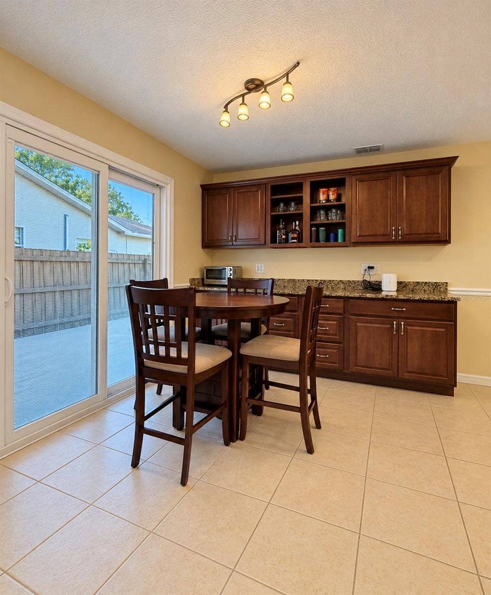 1231 ROSEWOOD STREET, Largo, FL 33770 Dining with sliders to paver entertainment area