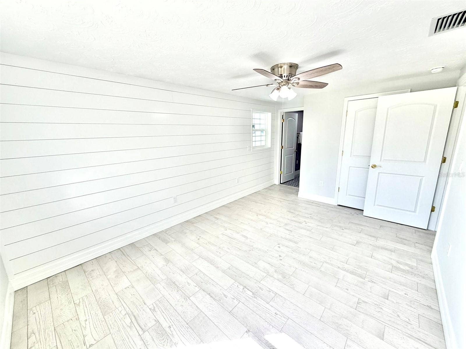 336 SHADDOCK STREET, Tarpon Springs, FL 34689 Primary Bedroom with Shiplap Wall