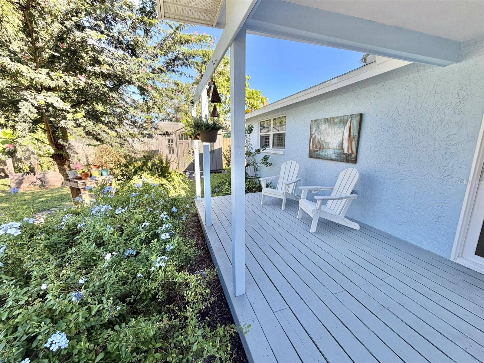 336 SHADDOCK STREET, Tarpon Springs, FL 34689 A Large Deck in the back yard is partially covered for all weather enjoyment.
