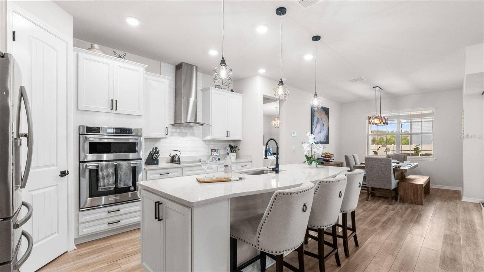 Kitchen: Expansive Island With Seating, Built-In Oven/Microwave, Range Hood, Cooktop