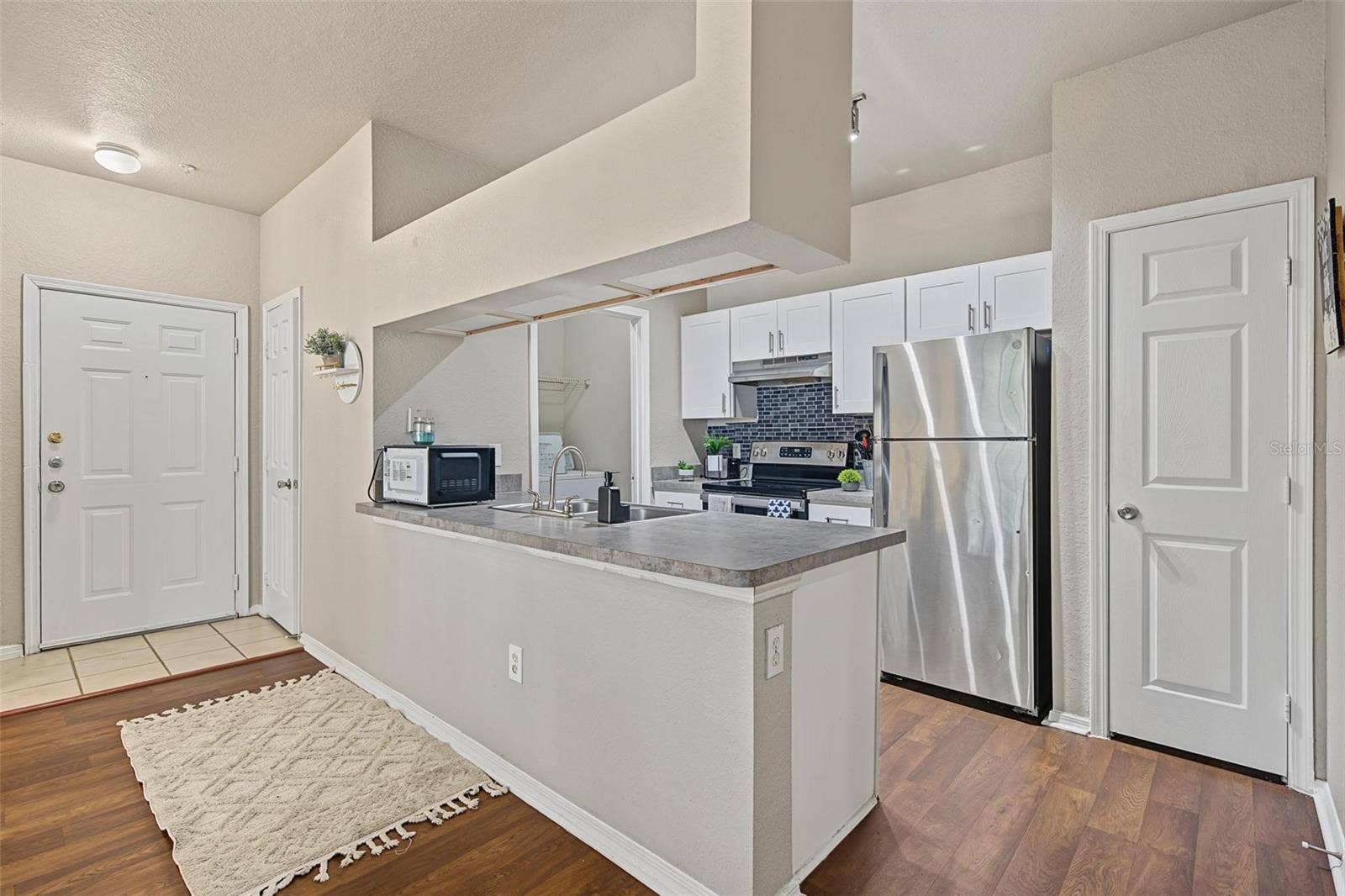 13123 SANCTUARY COVE DRIVE, #104, Temple Terrace, FL 33637 Kitchen Overlooking Living Room - 13123 Sanctuary Cove Drive - Unit 104