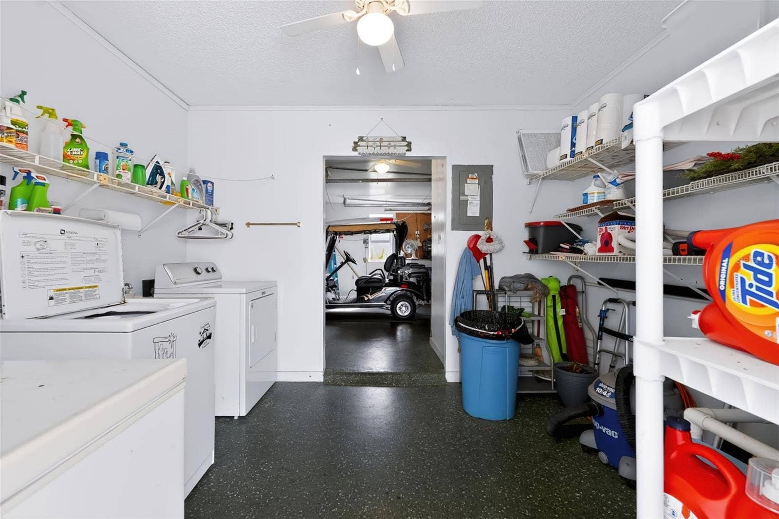 1220 MARIA COURT, Lady Lake, FL 32159 Laundry and storage connected to golf cart garage