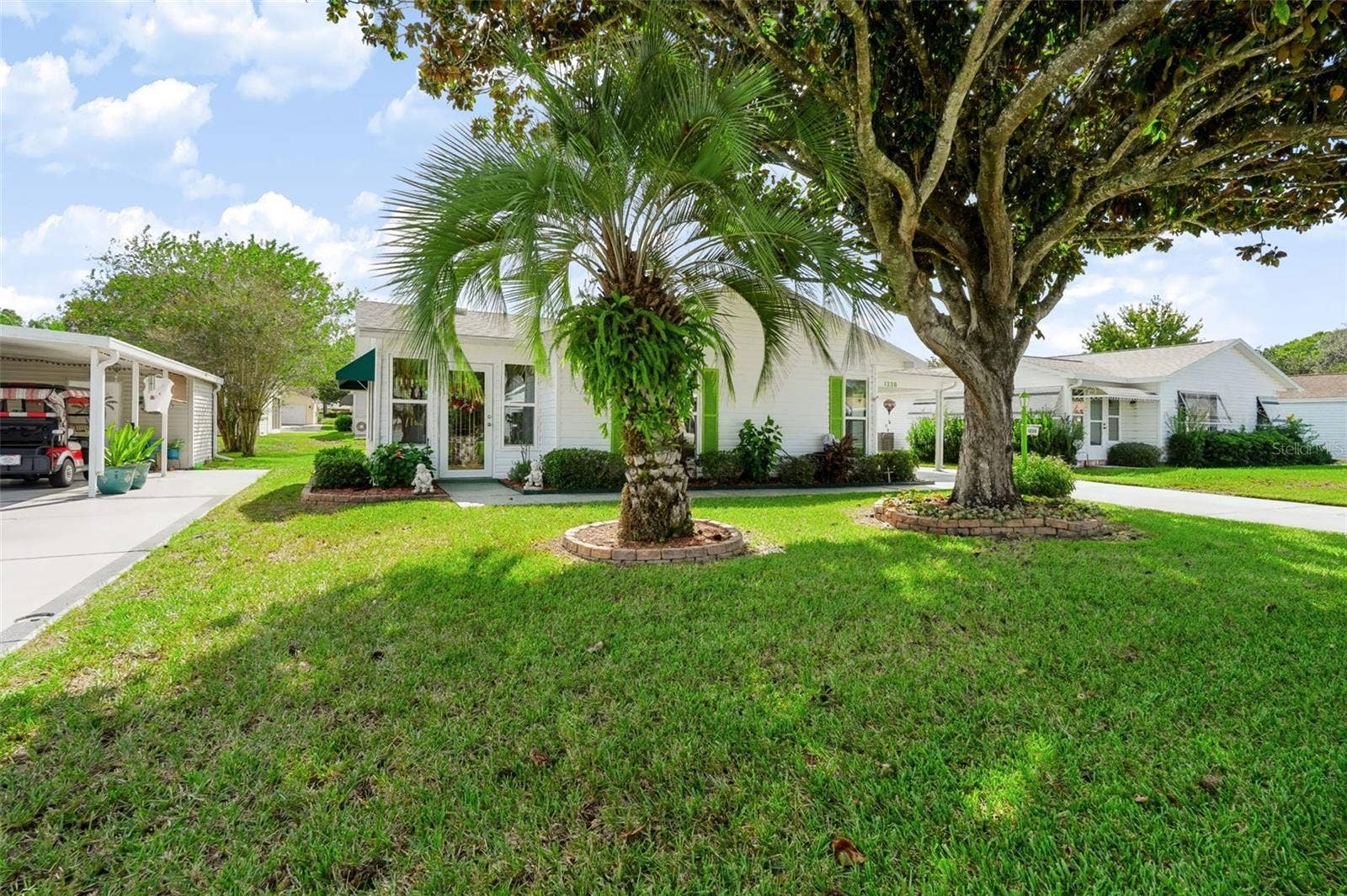 1220 MARIA COURT, Lady Lake, FL 32159 Mature landscaping, beautiful Magnolia Tree